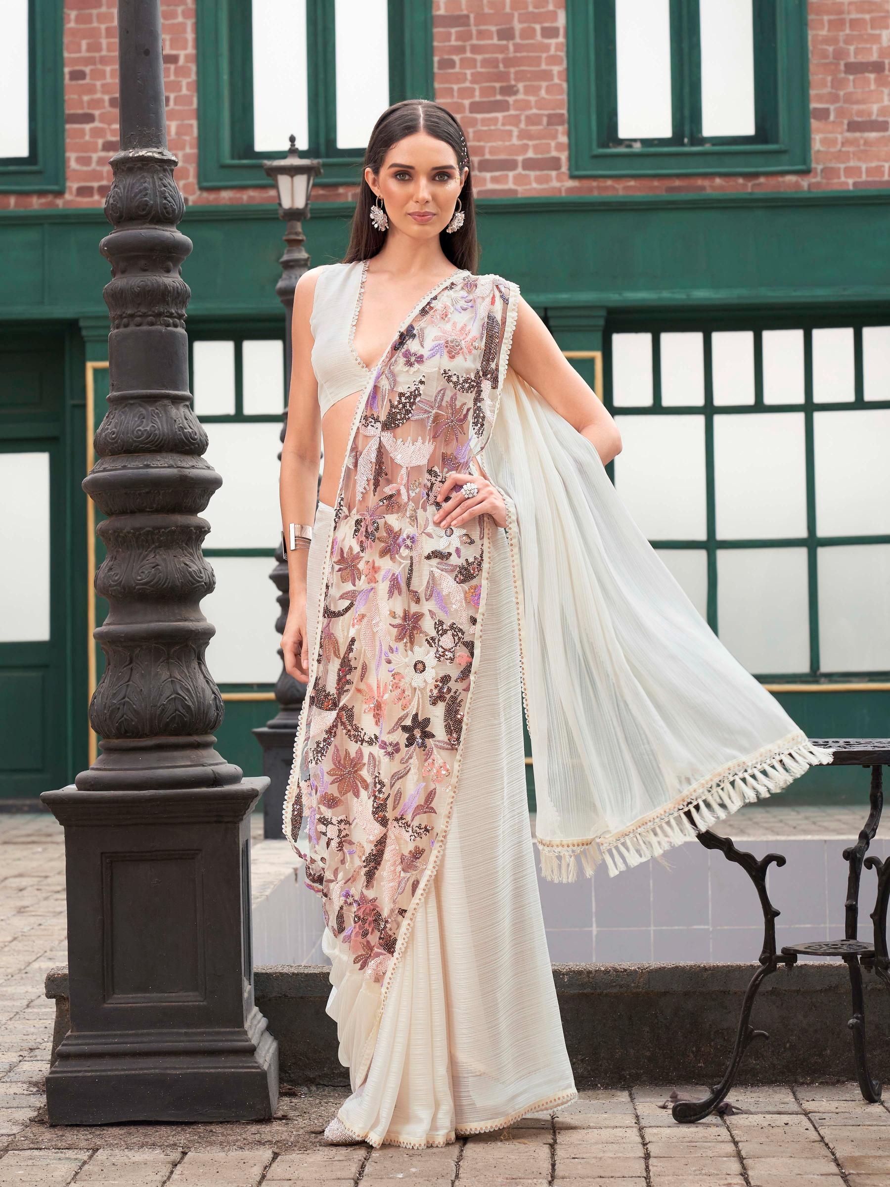 Cream colored designer saree with sequence and beads embroidery on shoulder portion