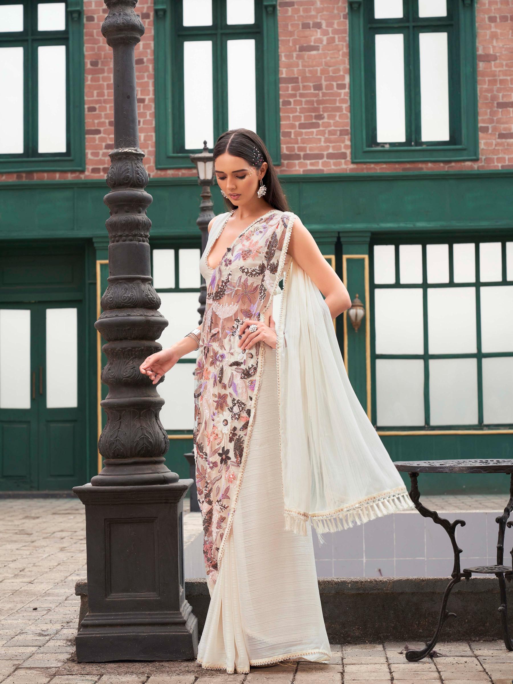 Cream colored designer saree with sequence and beads embroidery on shoulder portion