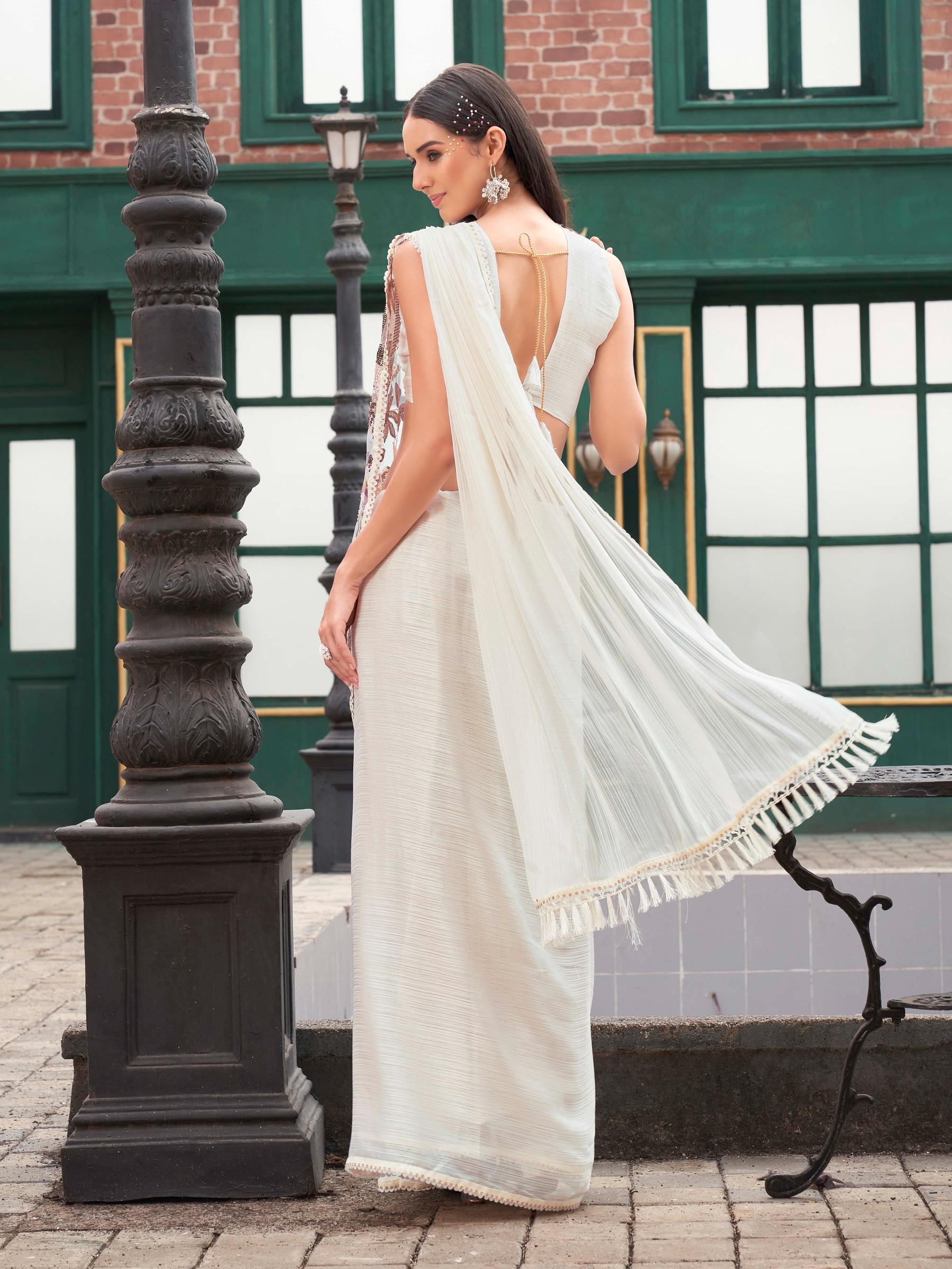 Cream colored designer saree with sequence and beads embroidery on shoulder portion