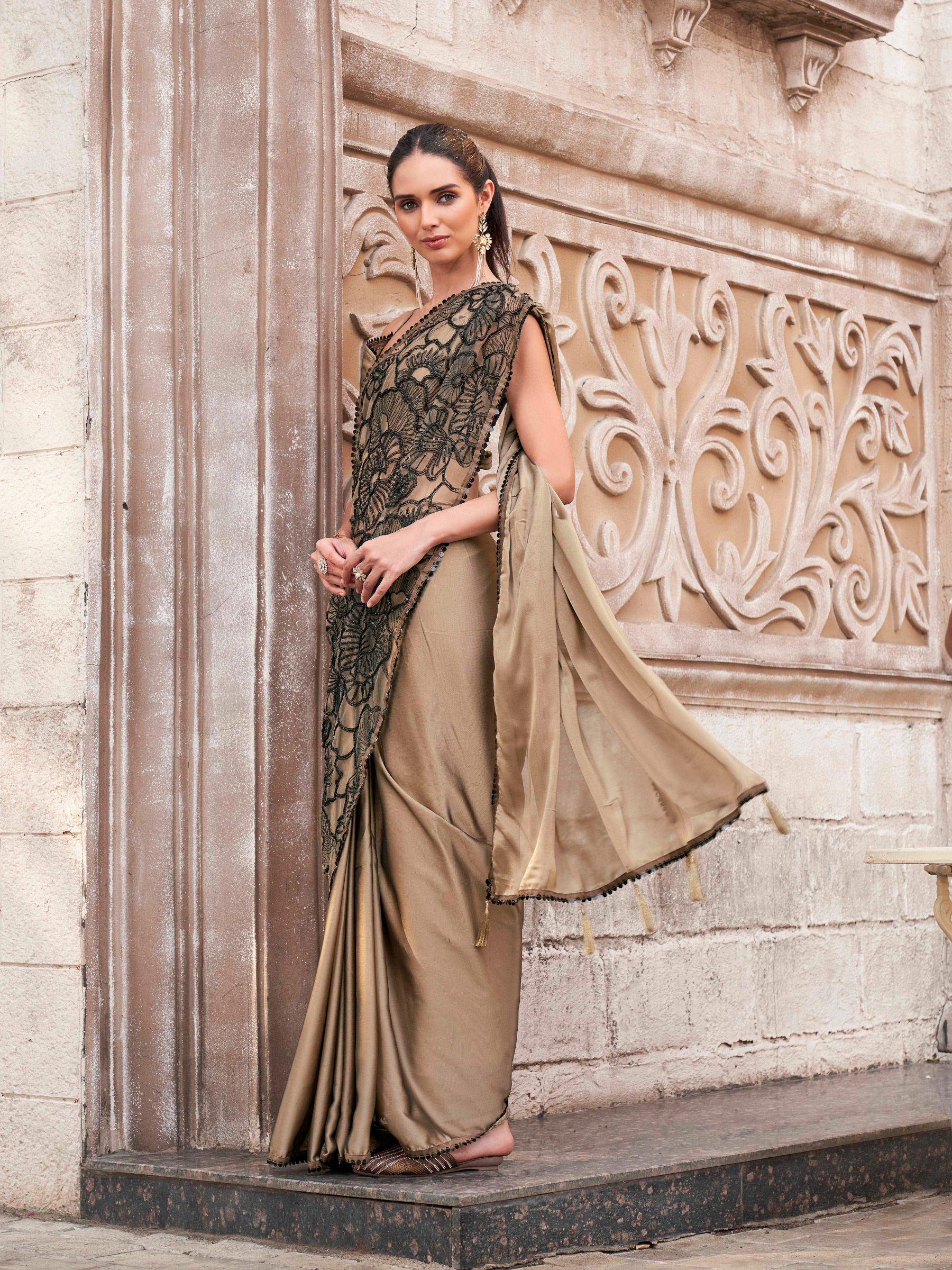 Brown colored designer saree with sequence and beads embroidery on shoulder portion