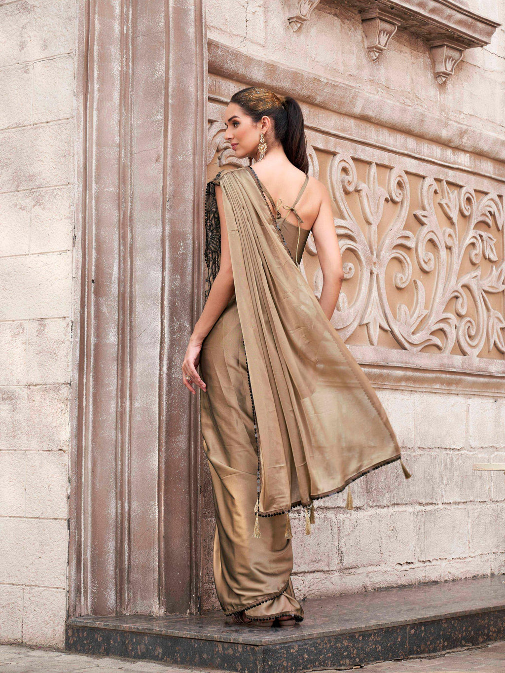 Brown colored designer saree with sequence and beads embroidery on shoulder portion