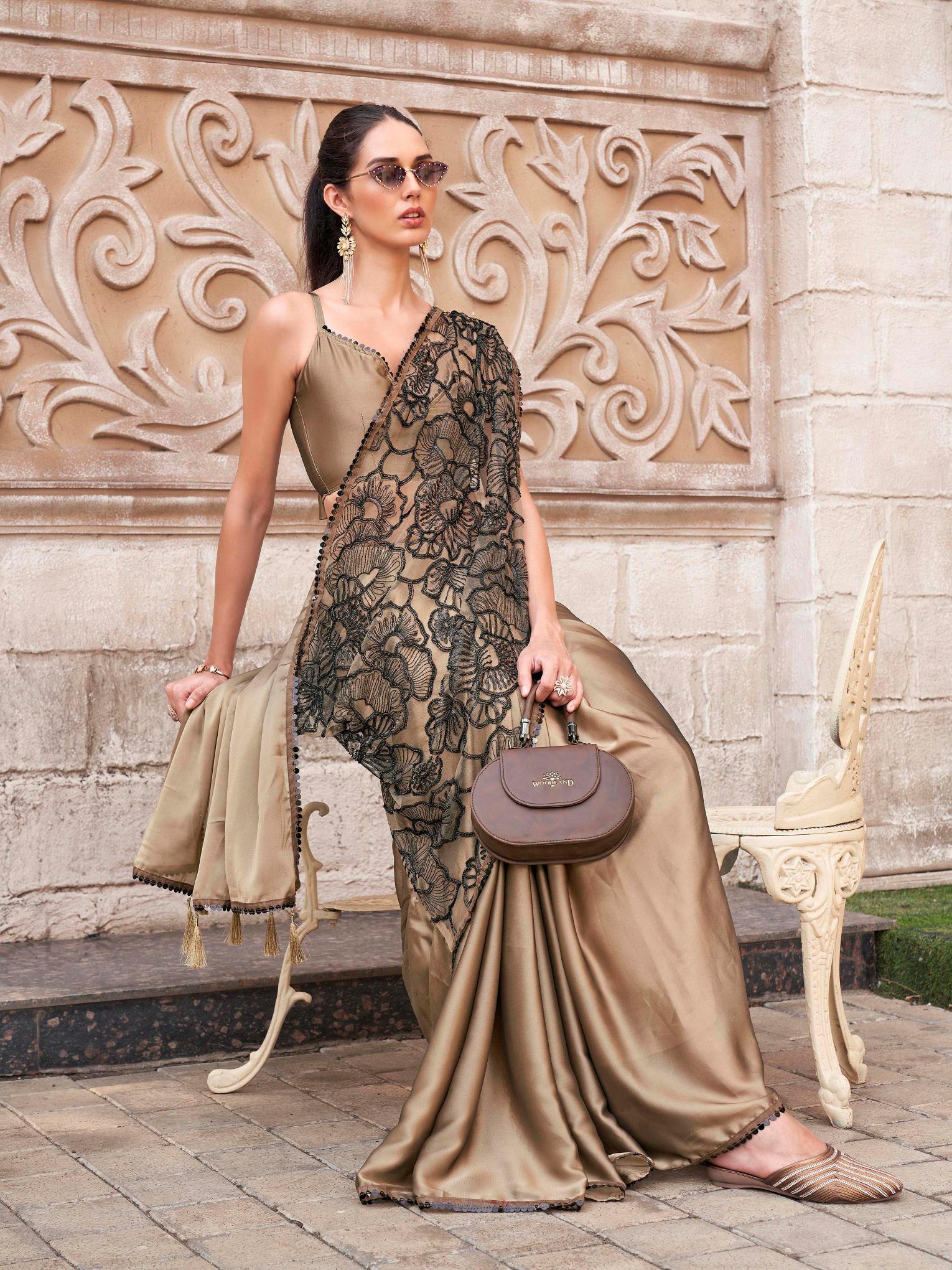 Brown colored designer saree with sequence and beads embroidery on shoulder portion
