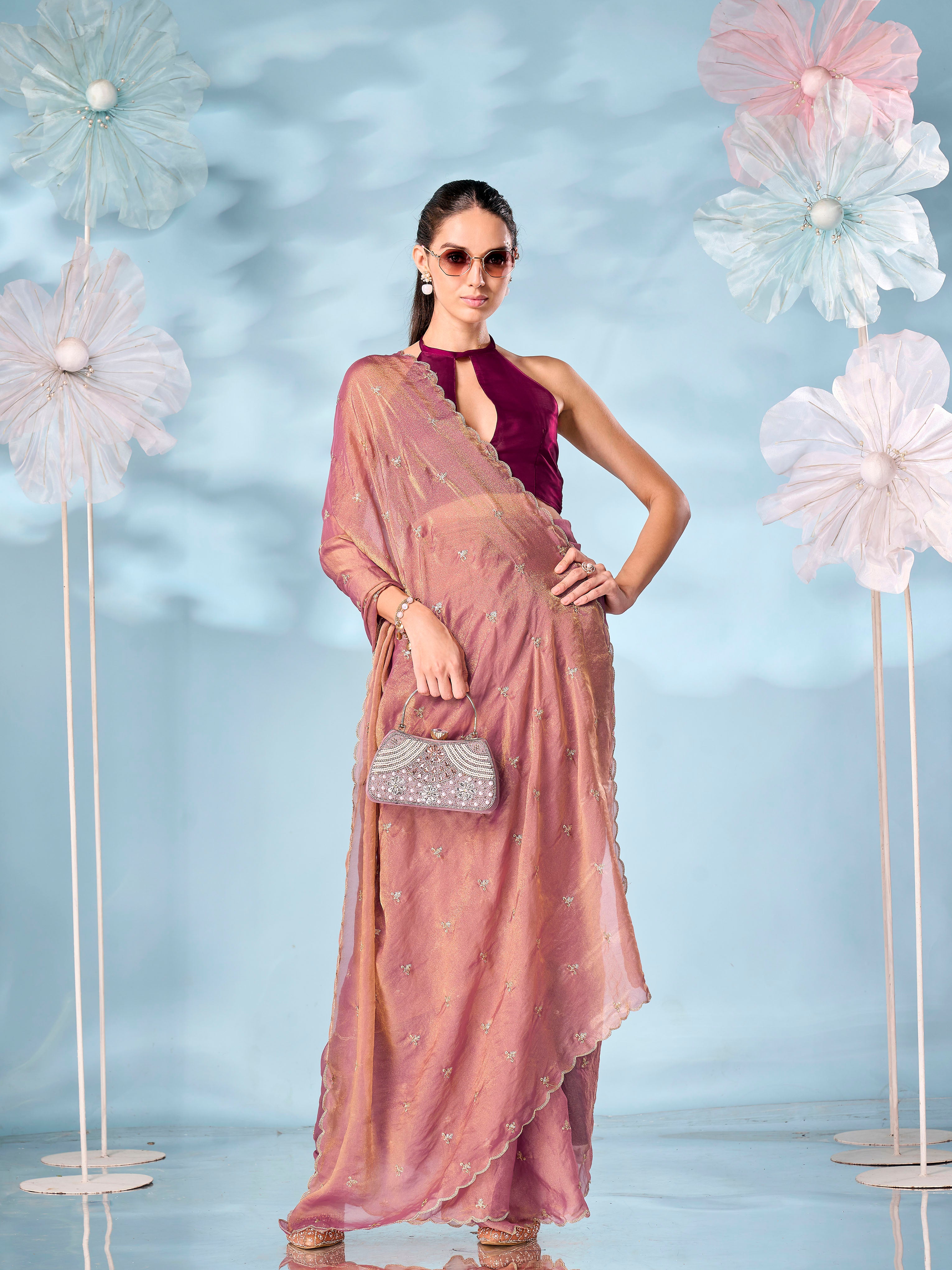 Rust colored sequinned butti shimmer saree with scalloped border