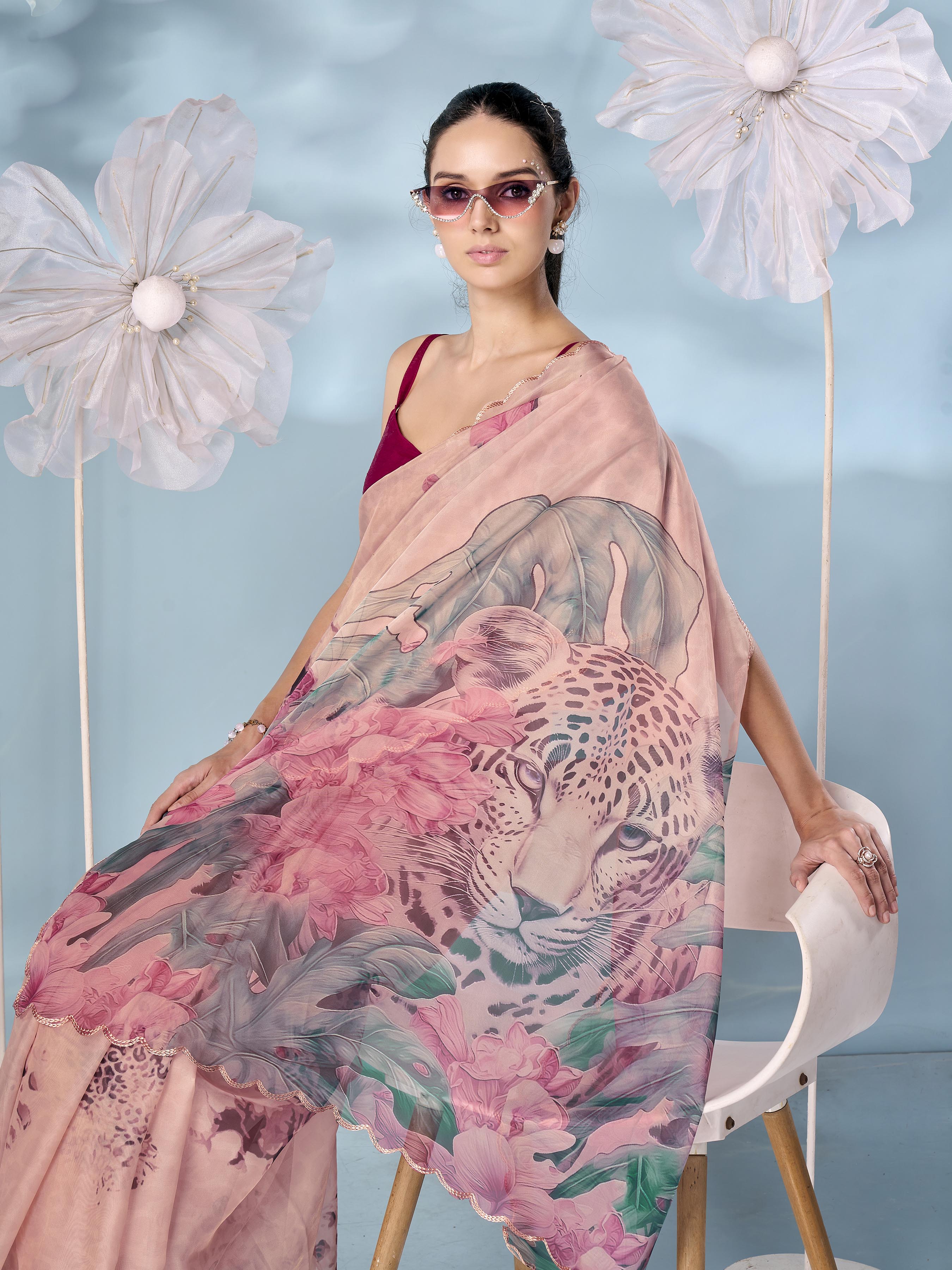 Peach colored designer animal print organza saree with scalloped border