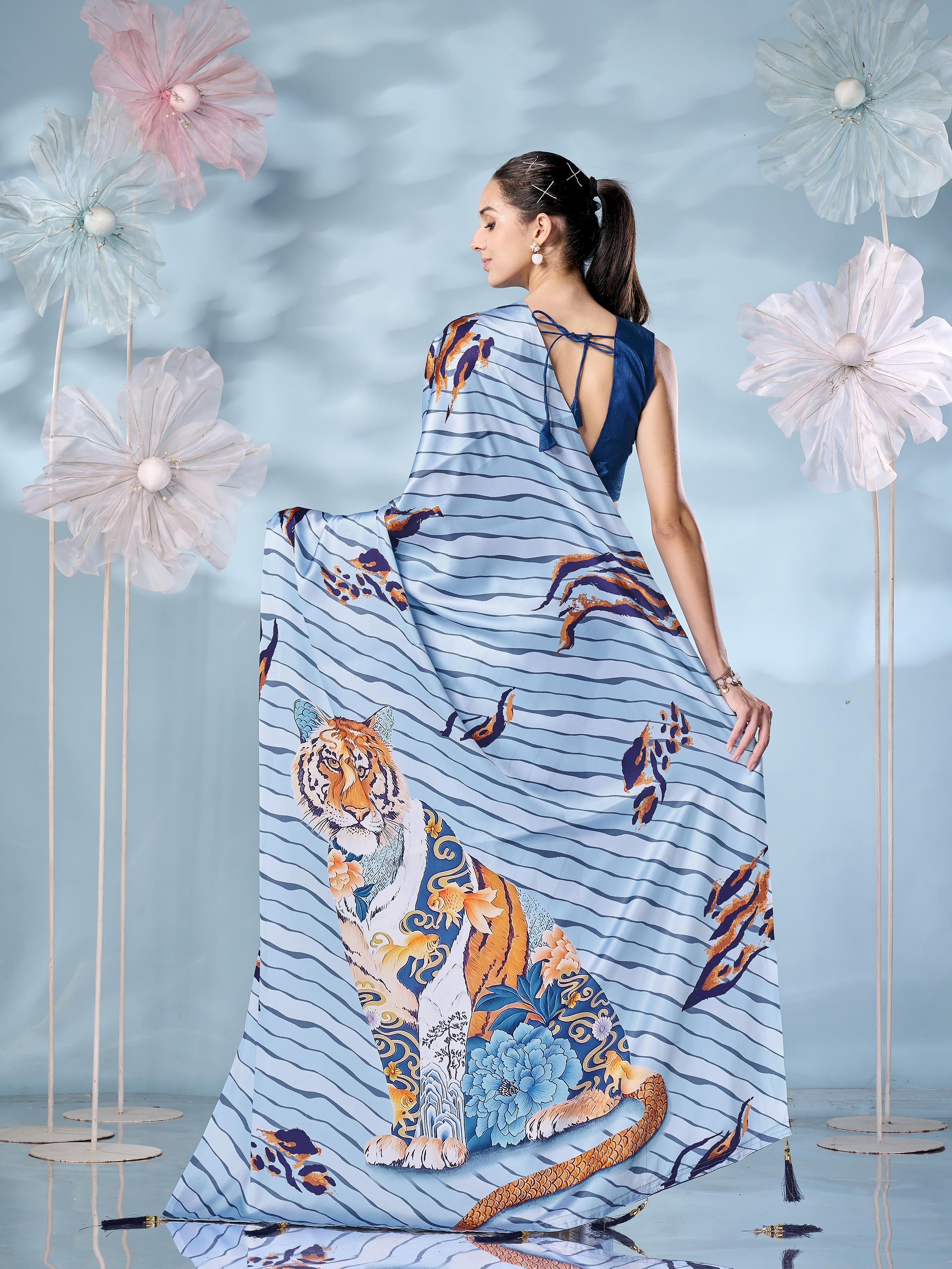 Blue colored designer animal print designer satin saree