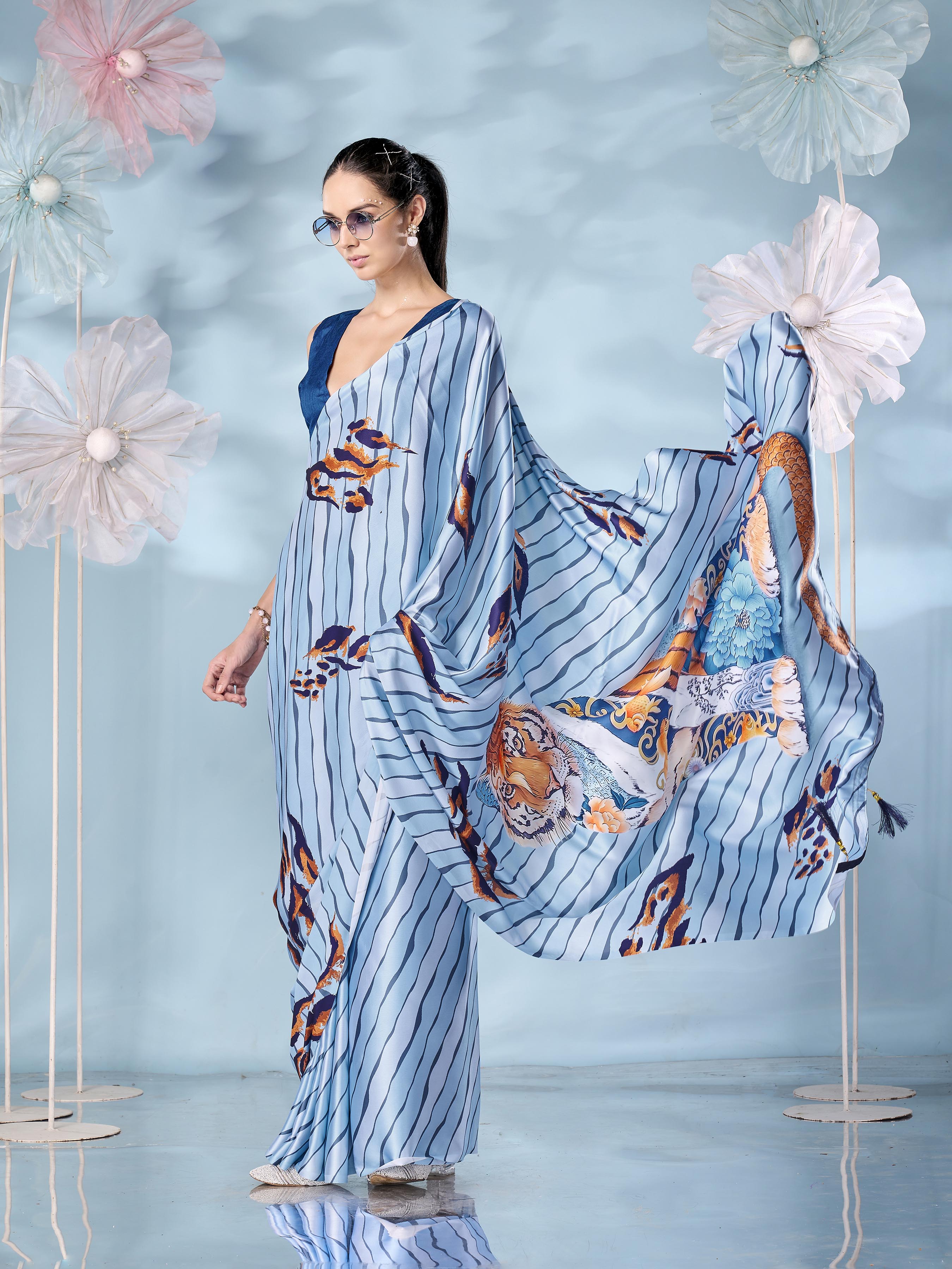 Blue colored designer animal print designer satin saree