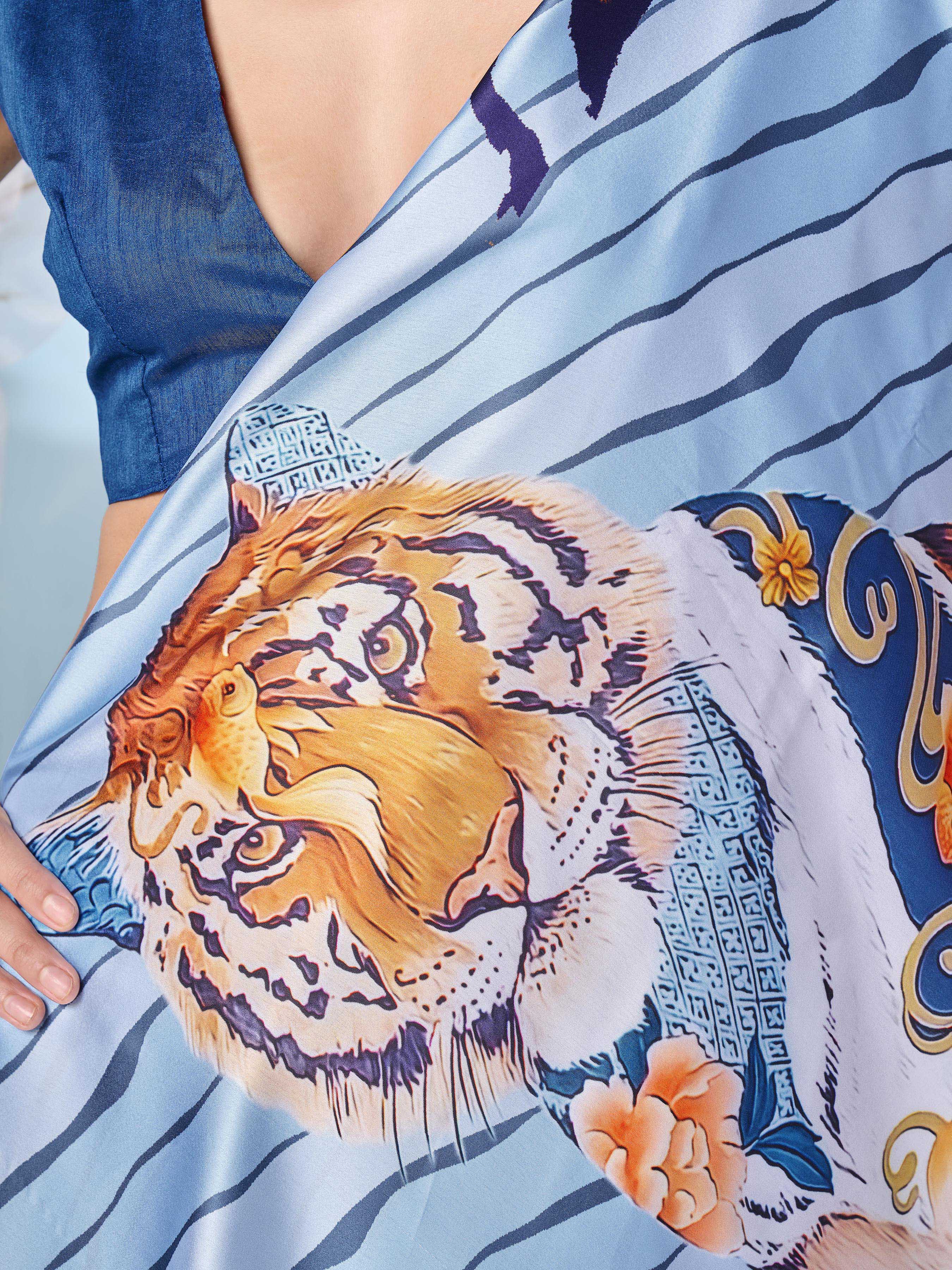 Blue colored designer animal print designer satin saree