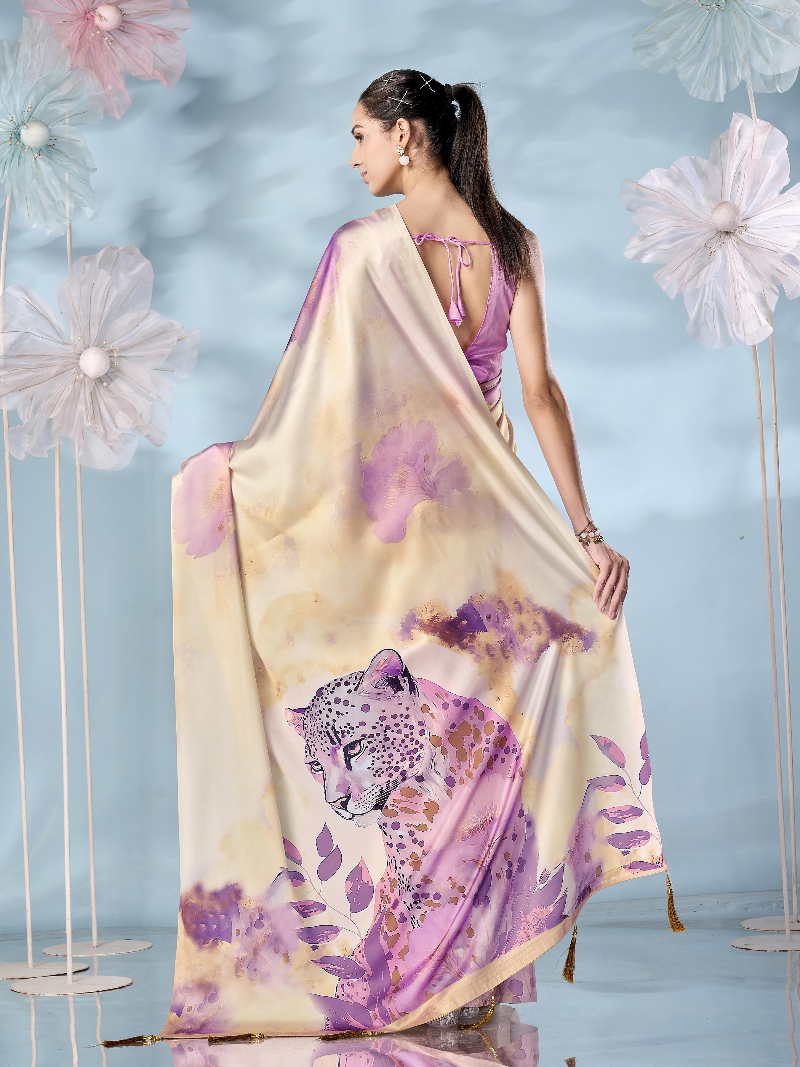 Cream colored designer animal print designer satin saree