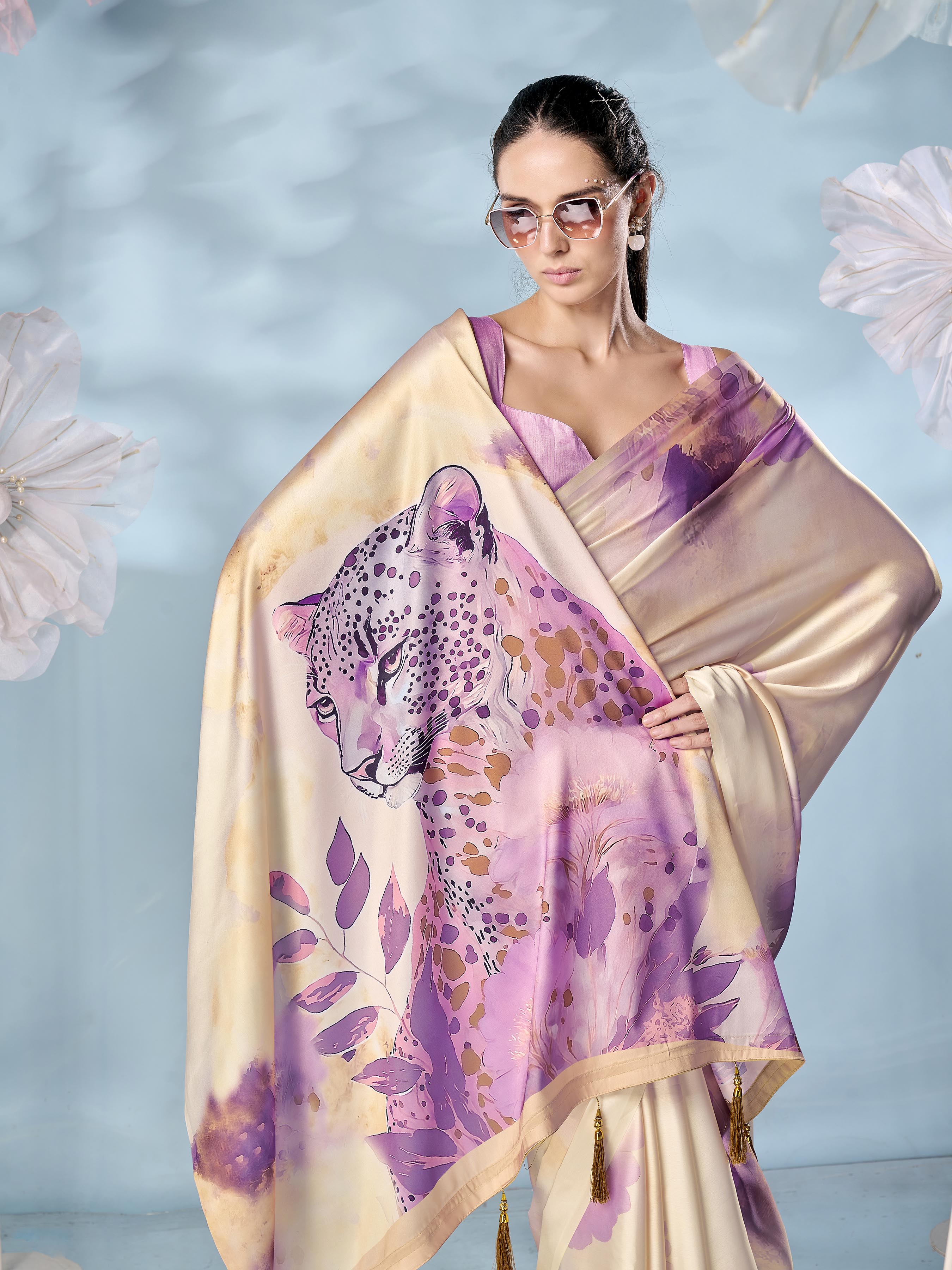 Cream colored designer animal print designer satin saree