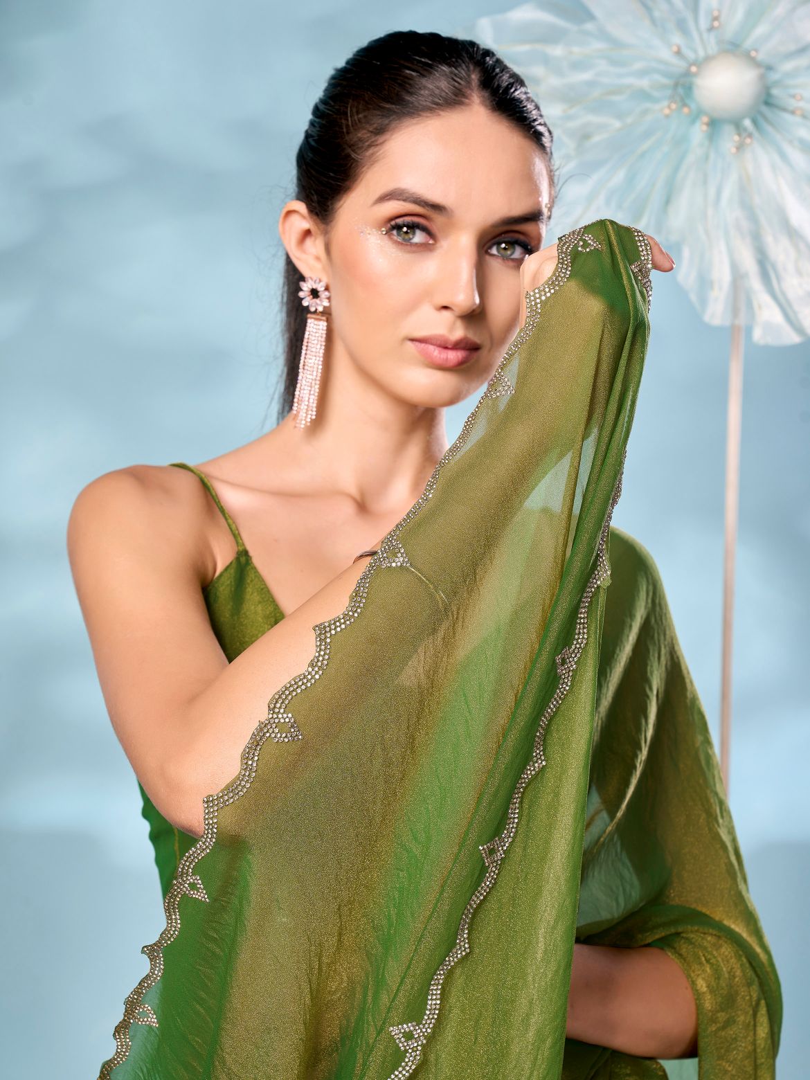 Two tone green and gold colored shimmer saree with swaroski border