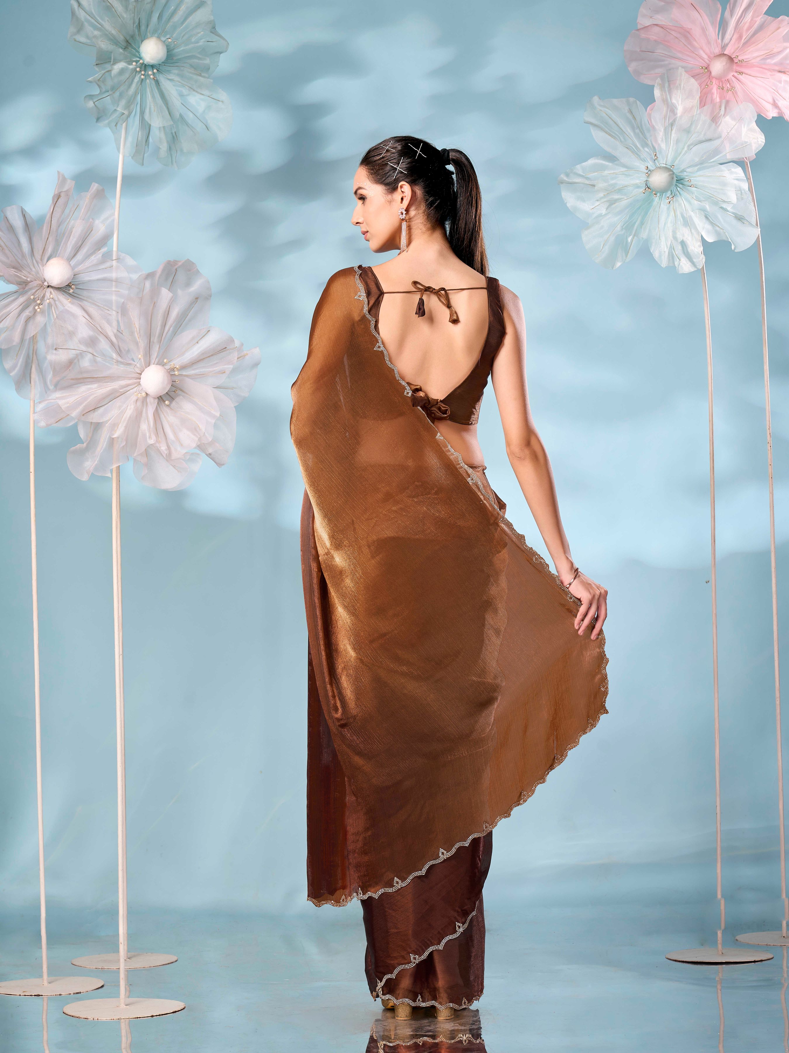 Two tone rust & brown colored jimmy choo saree with  swaroski border