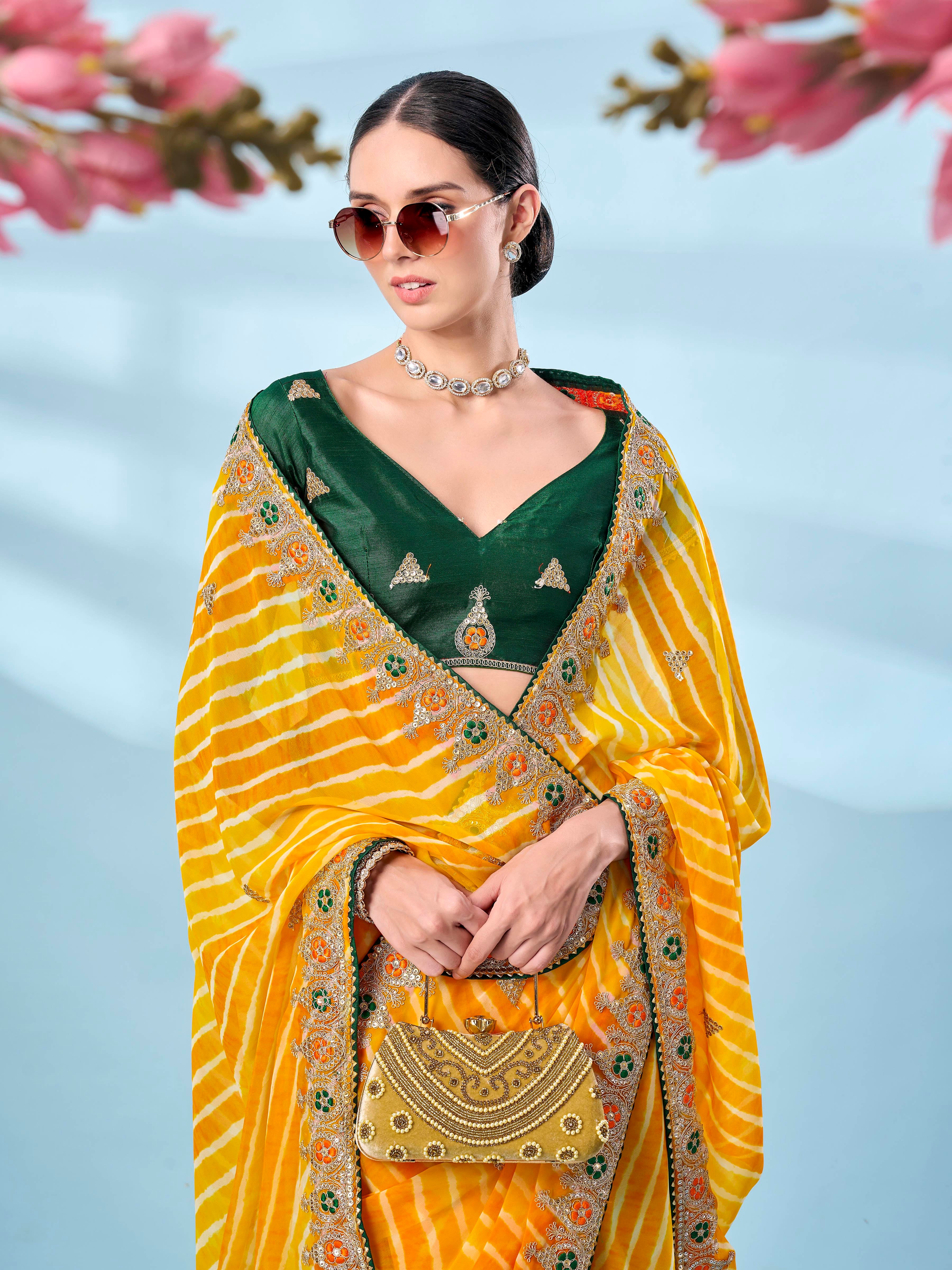 Yellow colored leheriya printed embroidered saree