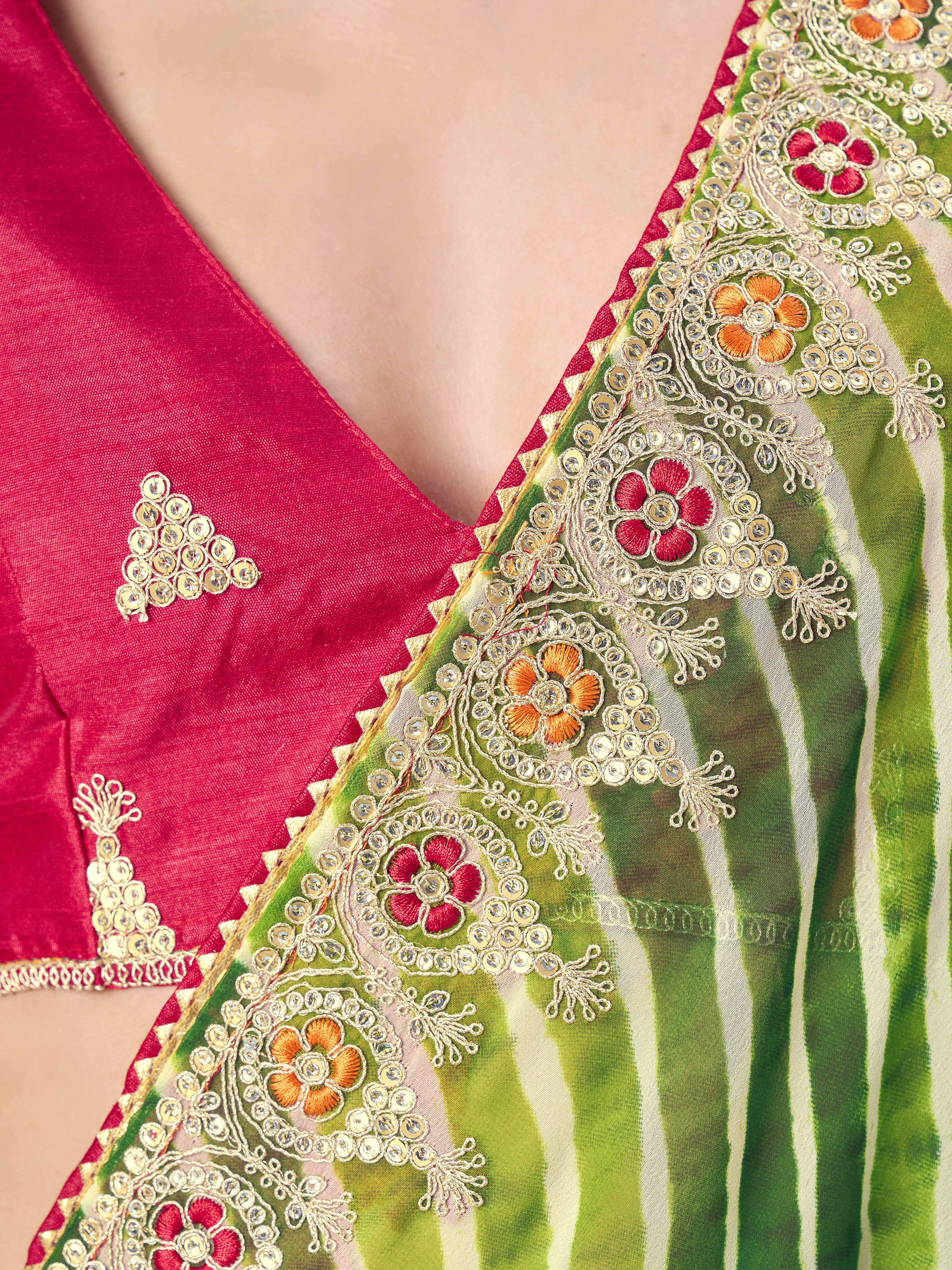 Green colored leheriya printed embroidered saree