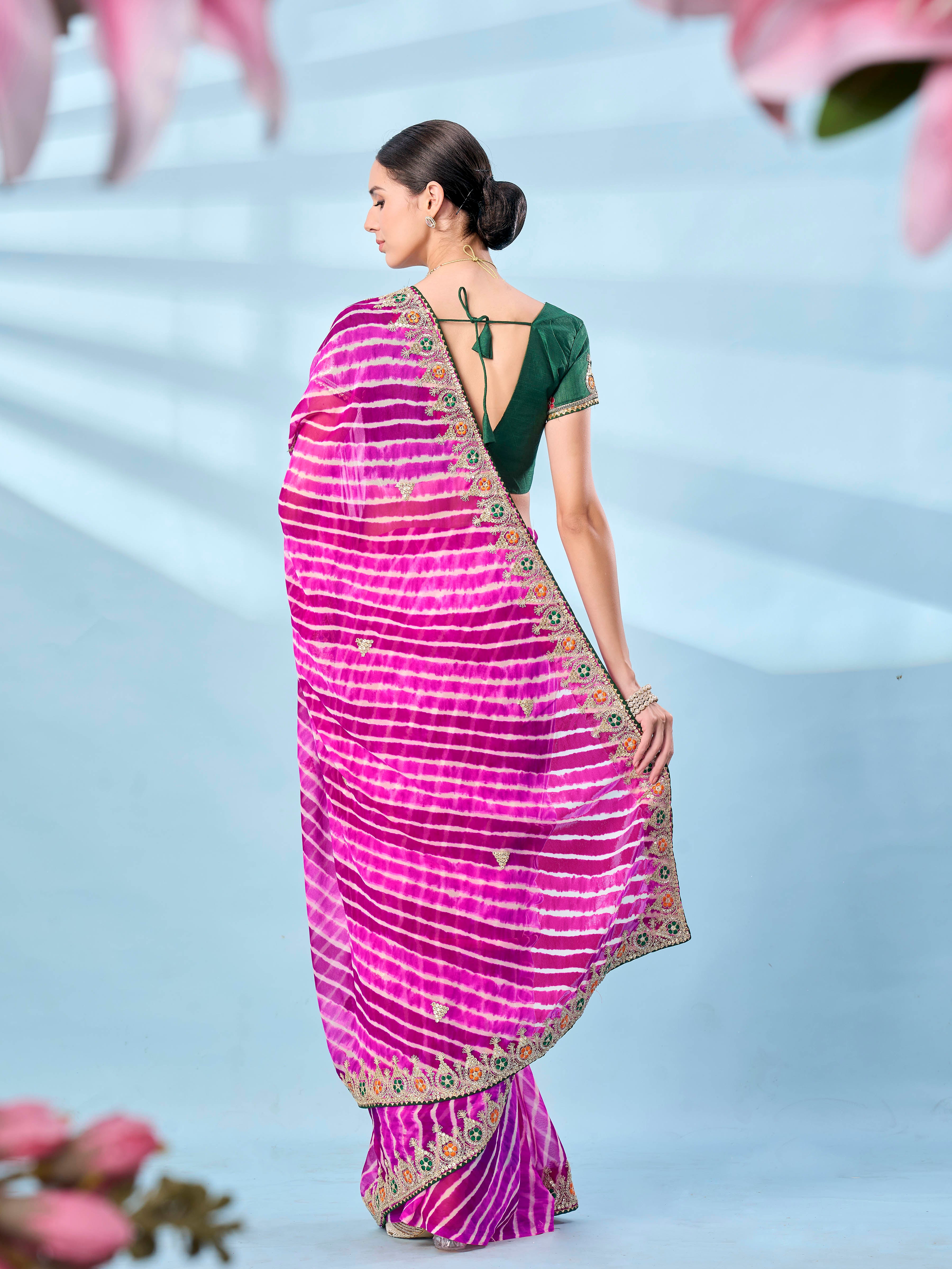 Pink colored leheriya printed embroidered saree