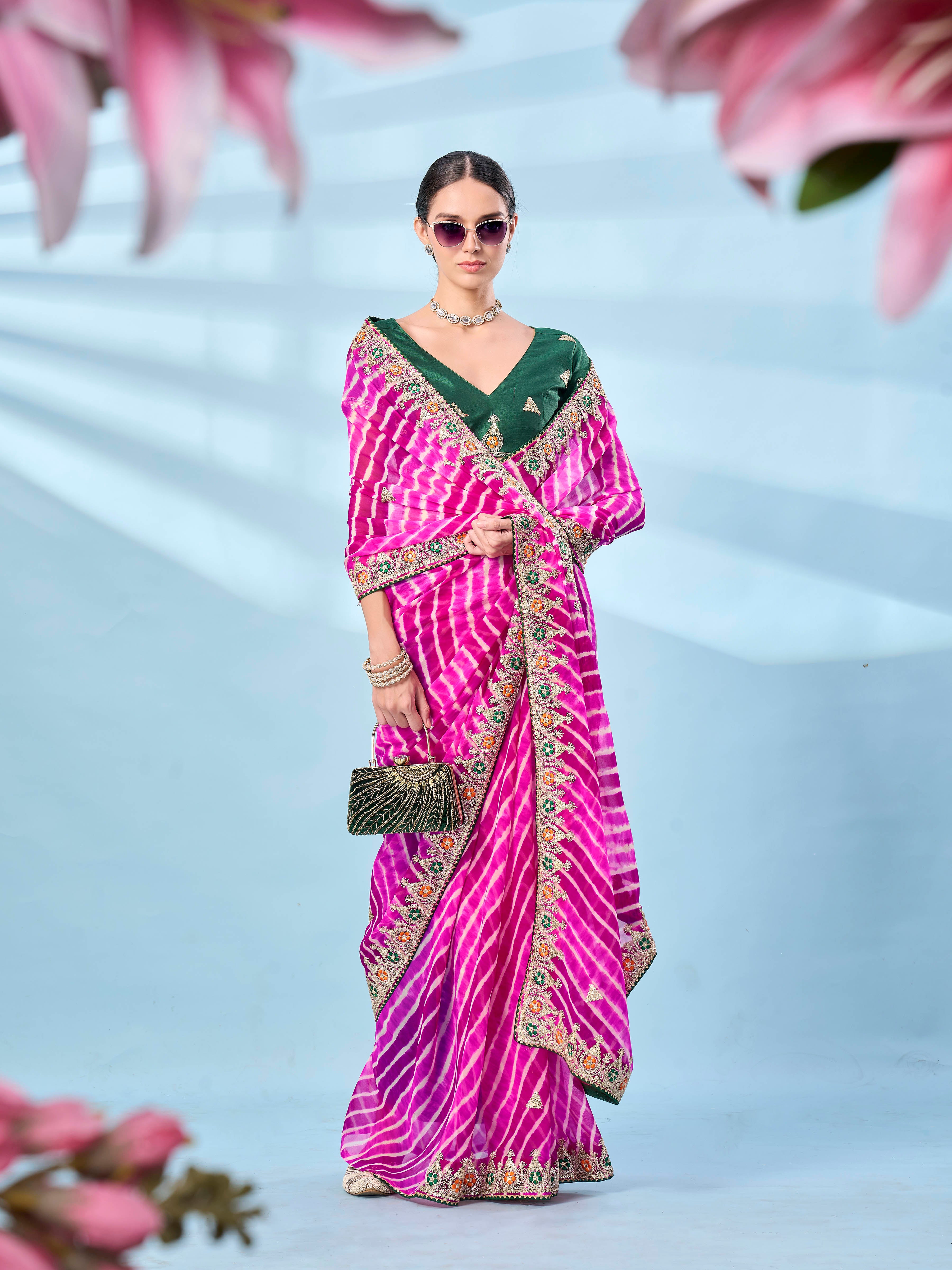 Pink colored leheriya printed embroidered saree