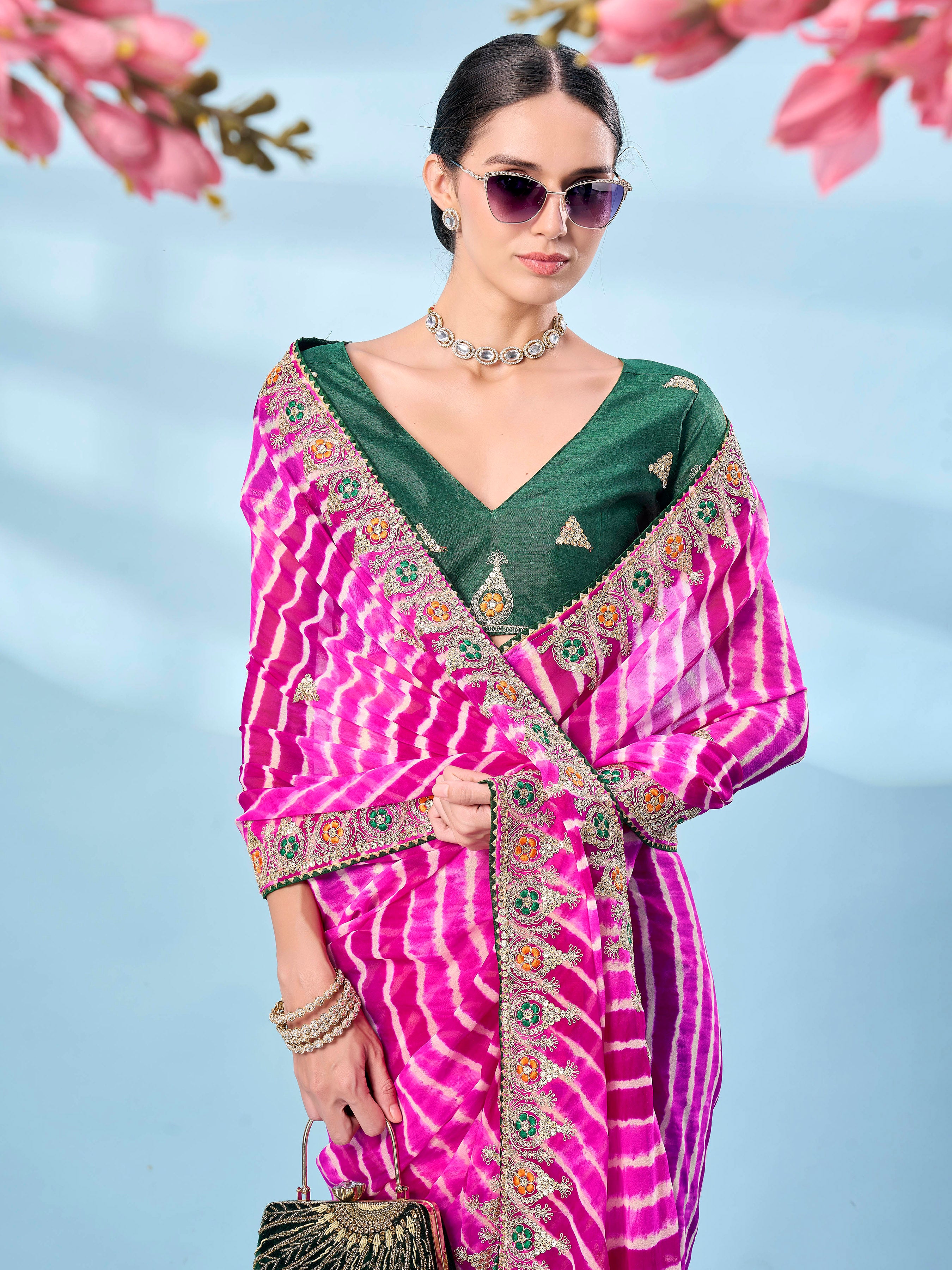 Pink colored leheriya printed embroidered saree