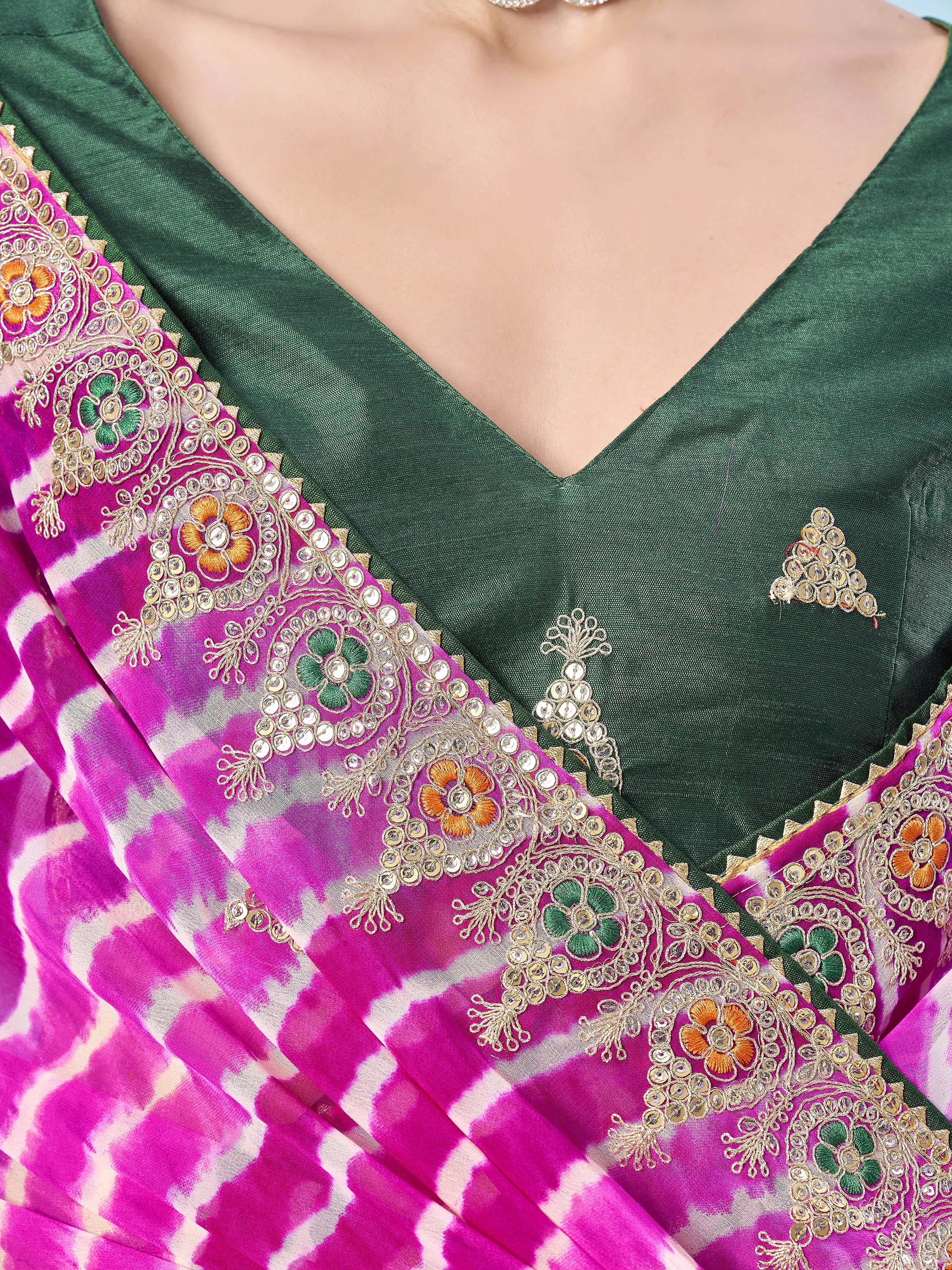 Pink colored leheriya printed embroidered saree