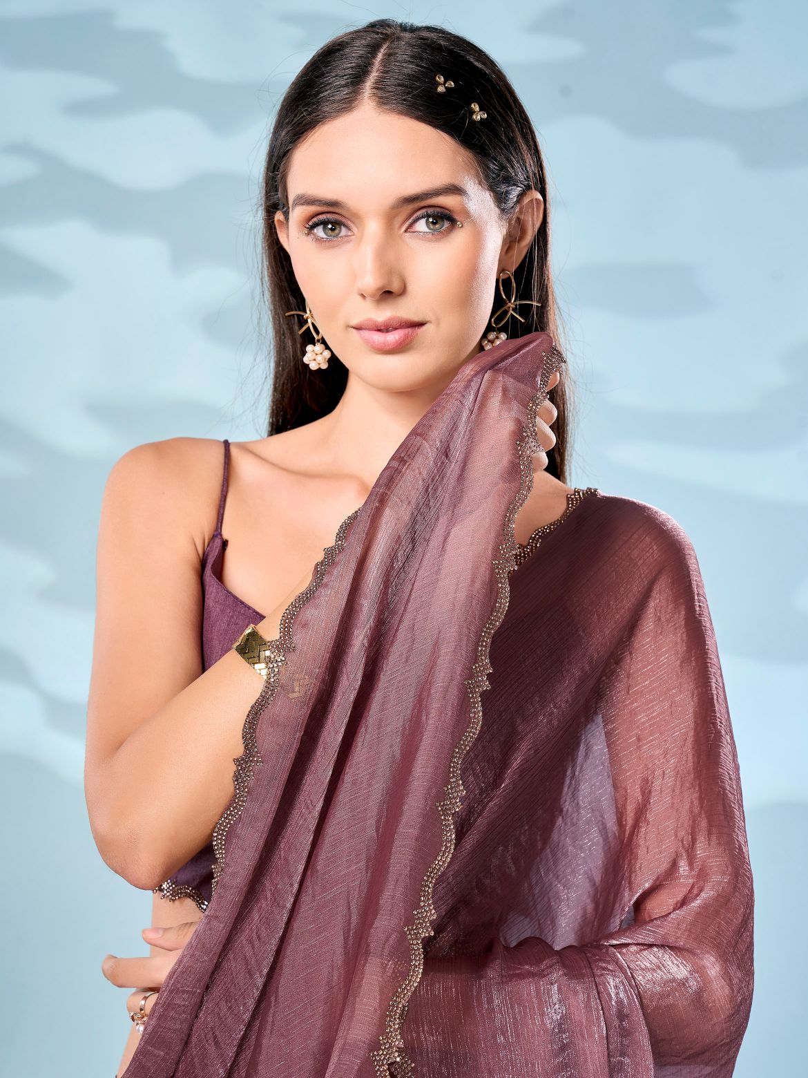 Mauve colored designer jimmy choo saree with swaroski border
