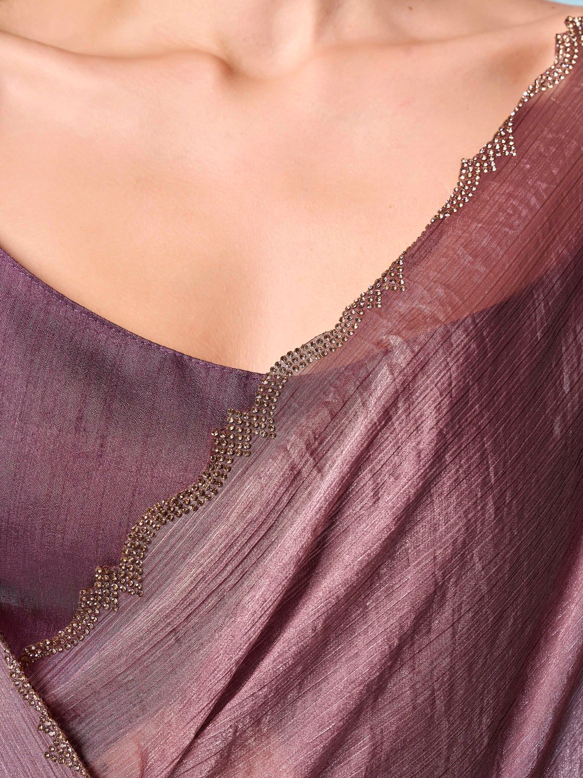 Mauve colored designer jimmy choo saree with swaroski border
