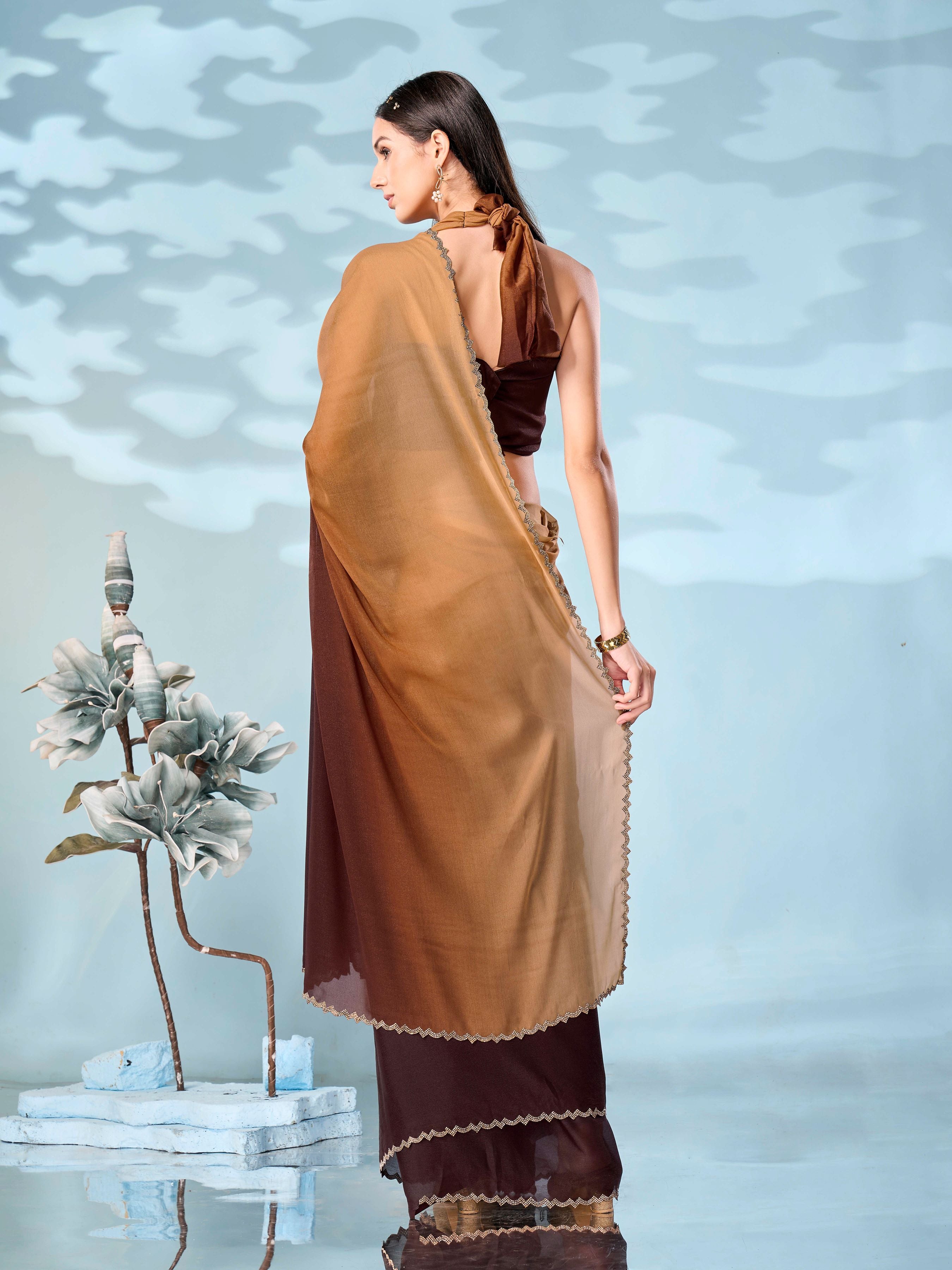 Ombre peach & brown colored designer saree with swaroski border