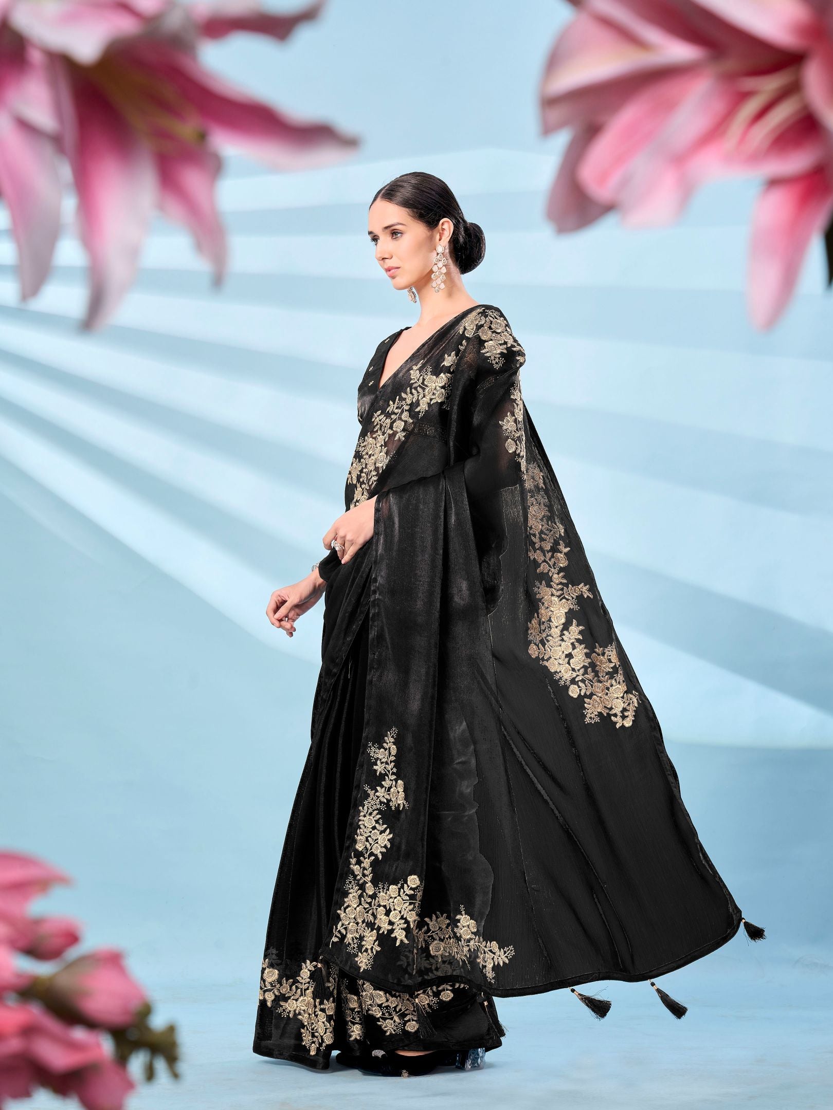 Black colored zari embroidered designer saree with tassles on pallu