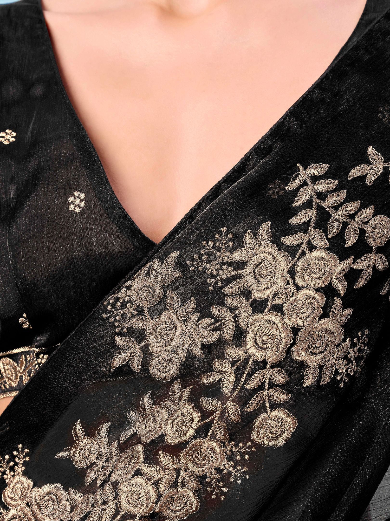 Black colored zari embroidered designer saree with tassles on pallu