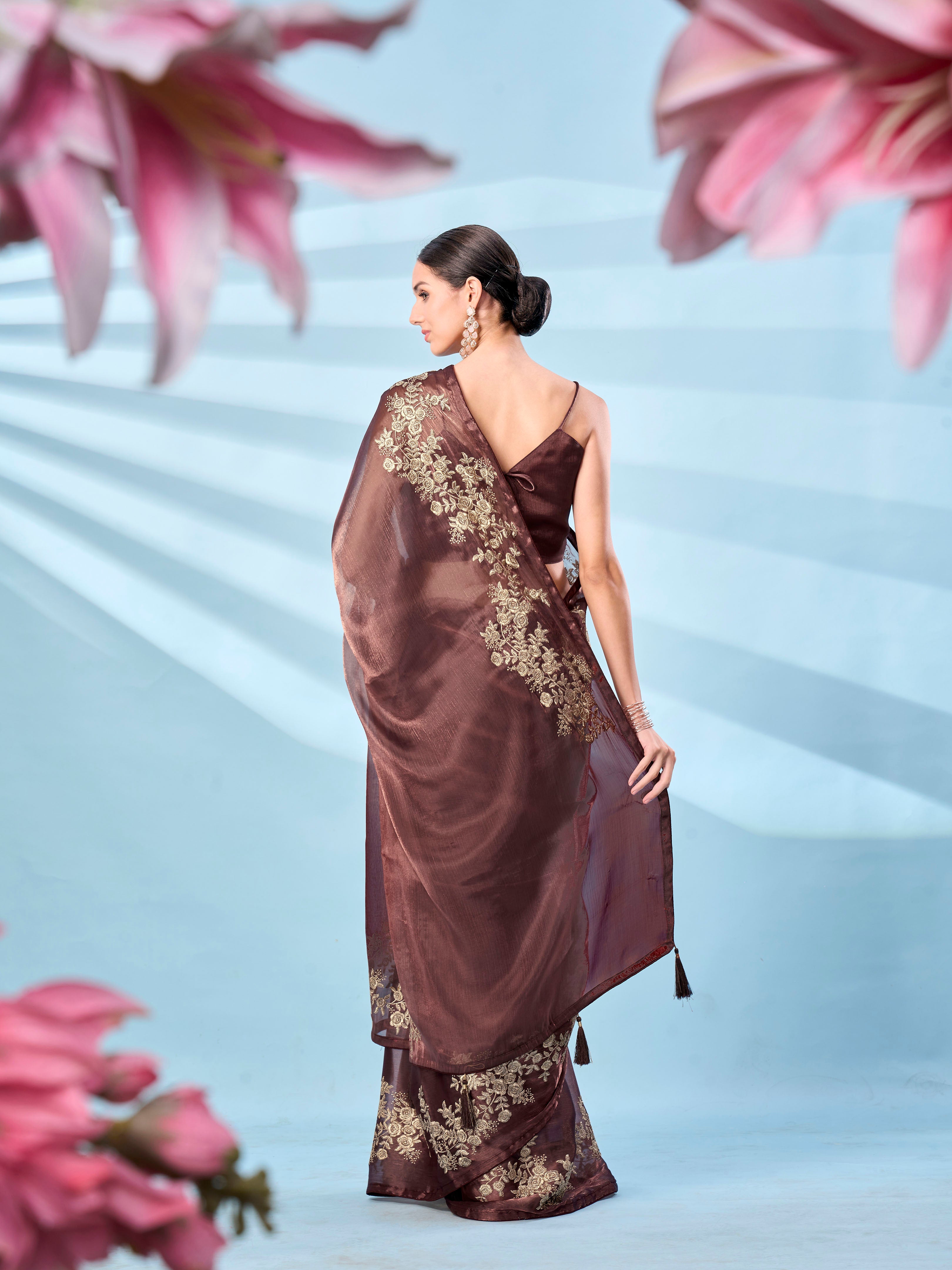 Metallic bronze colored zari embroidered saree with tassles on pallu