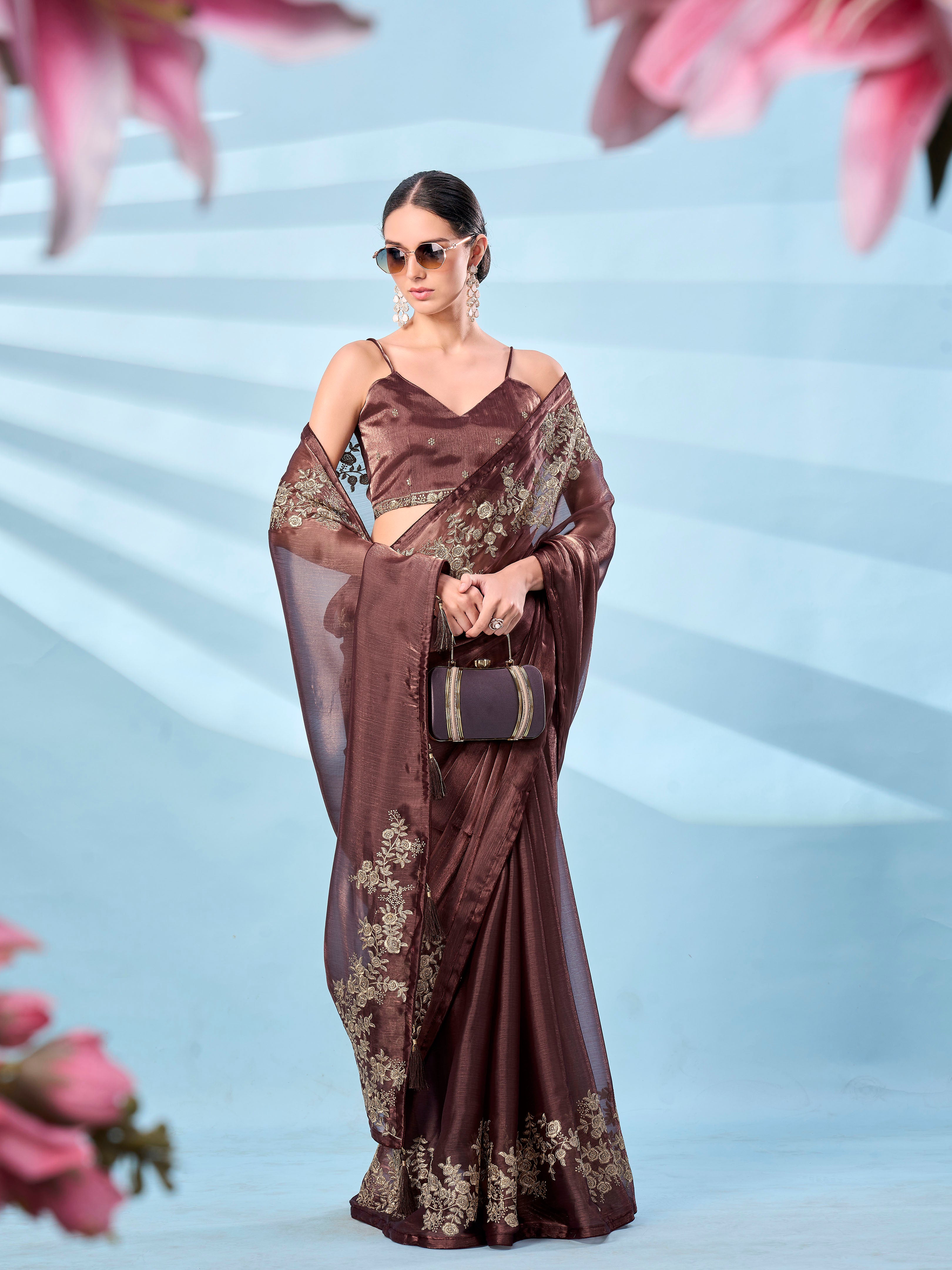 Metallic bronze colored zari embroidered saree with tassles on pallu