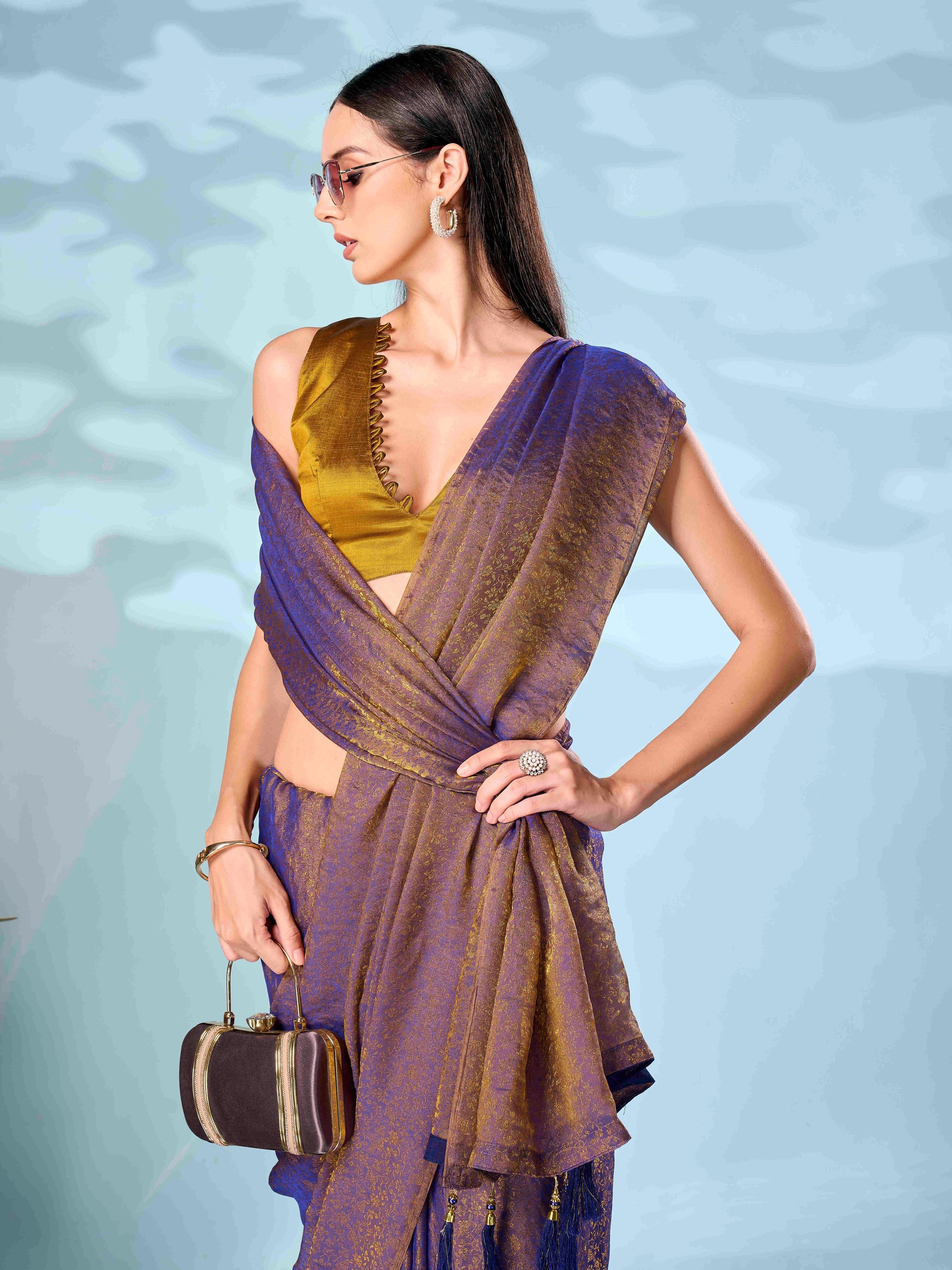 Two tone purple and mustard colored woven saree with tassles on pallu