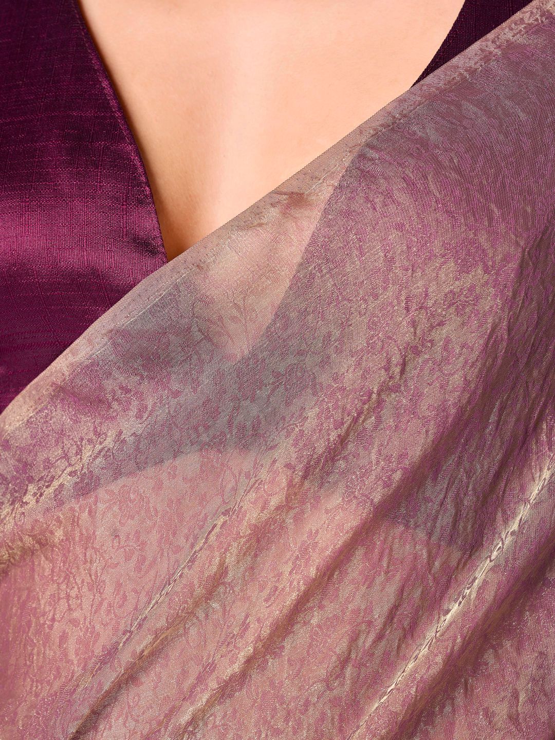 Two tone pink and gold colored woven saree with tassles on pallu