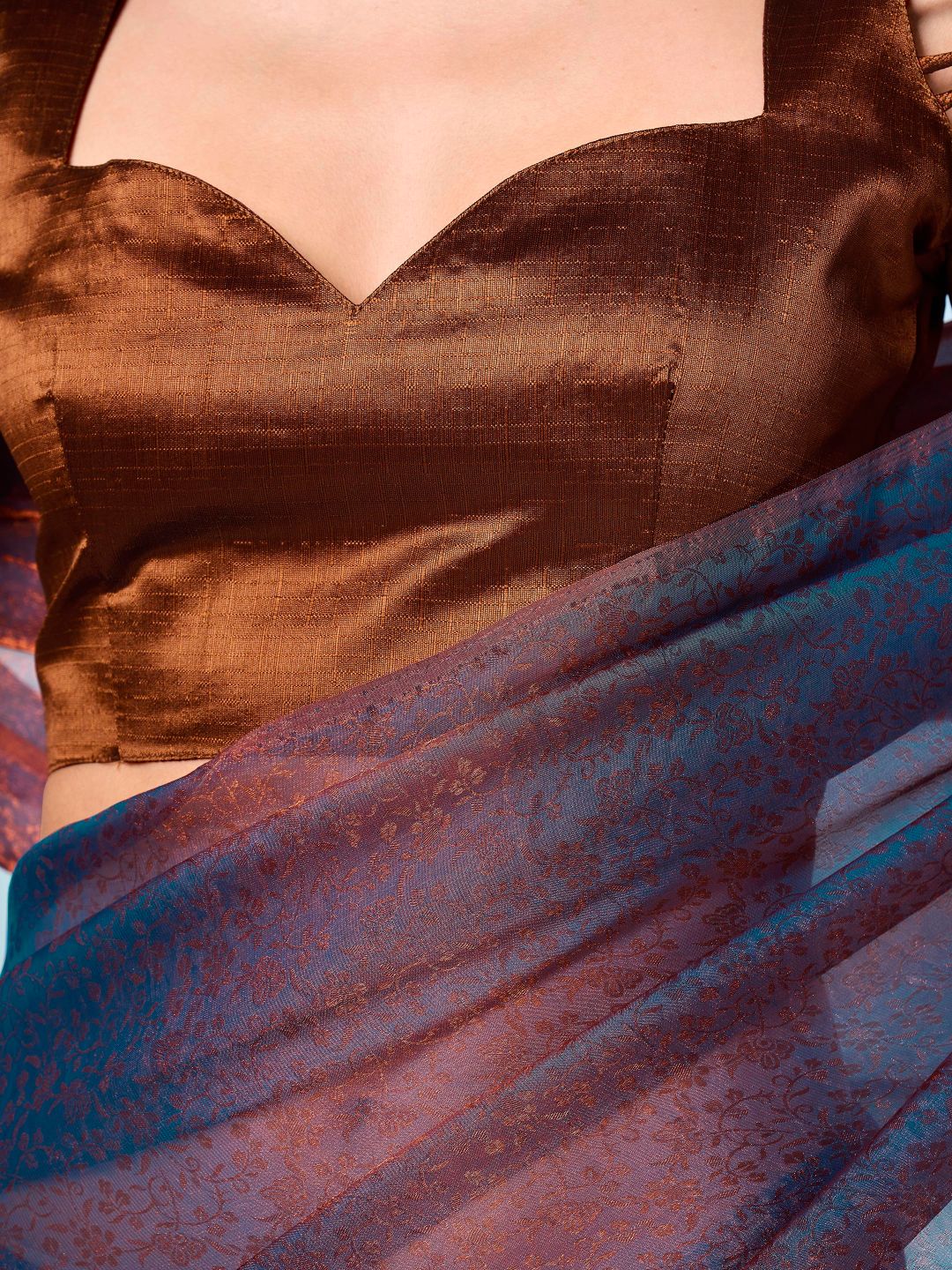 Two tone blue and bronze colored woven saree with tassles on pallu