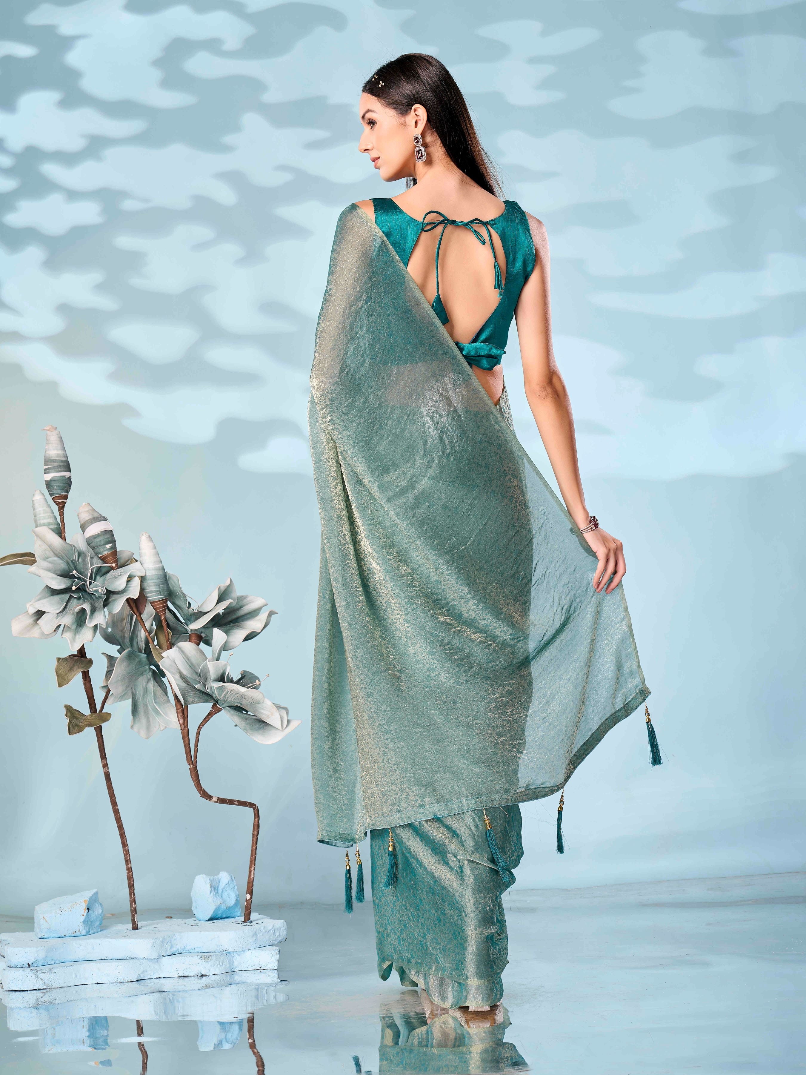 Two tone blue and gold colored woven saree with tassles on pallu