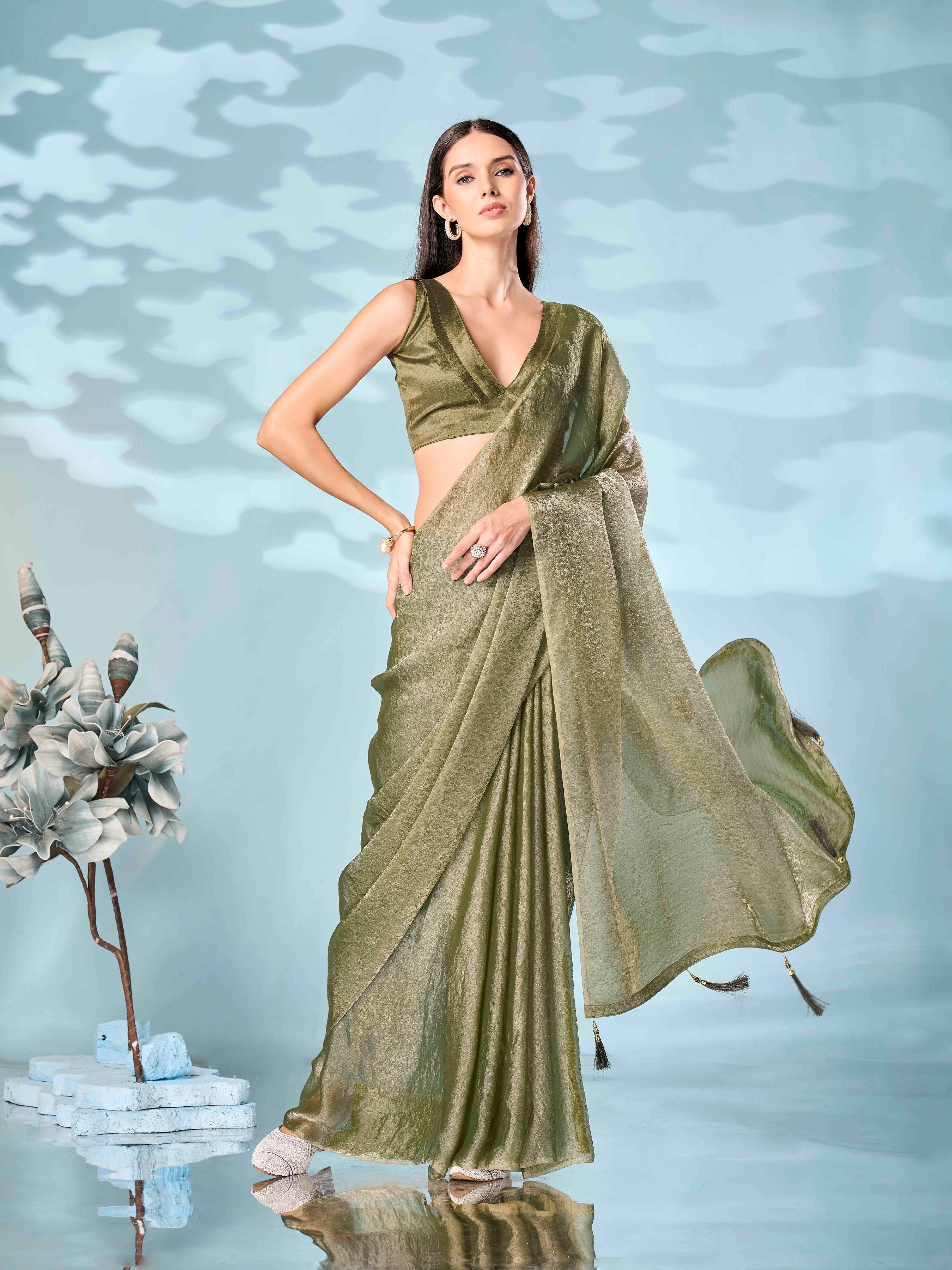 Two tone olive and gold colored woven saree with tassles on pallu