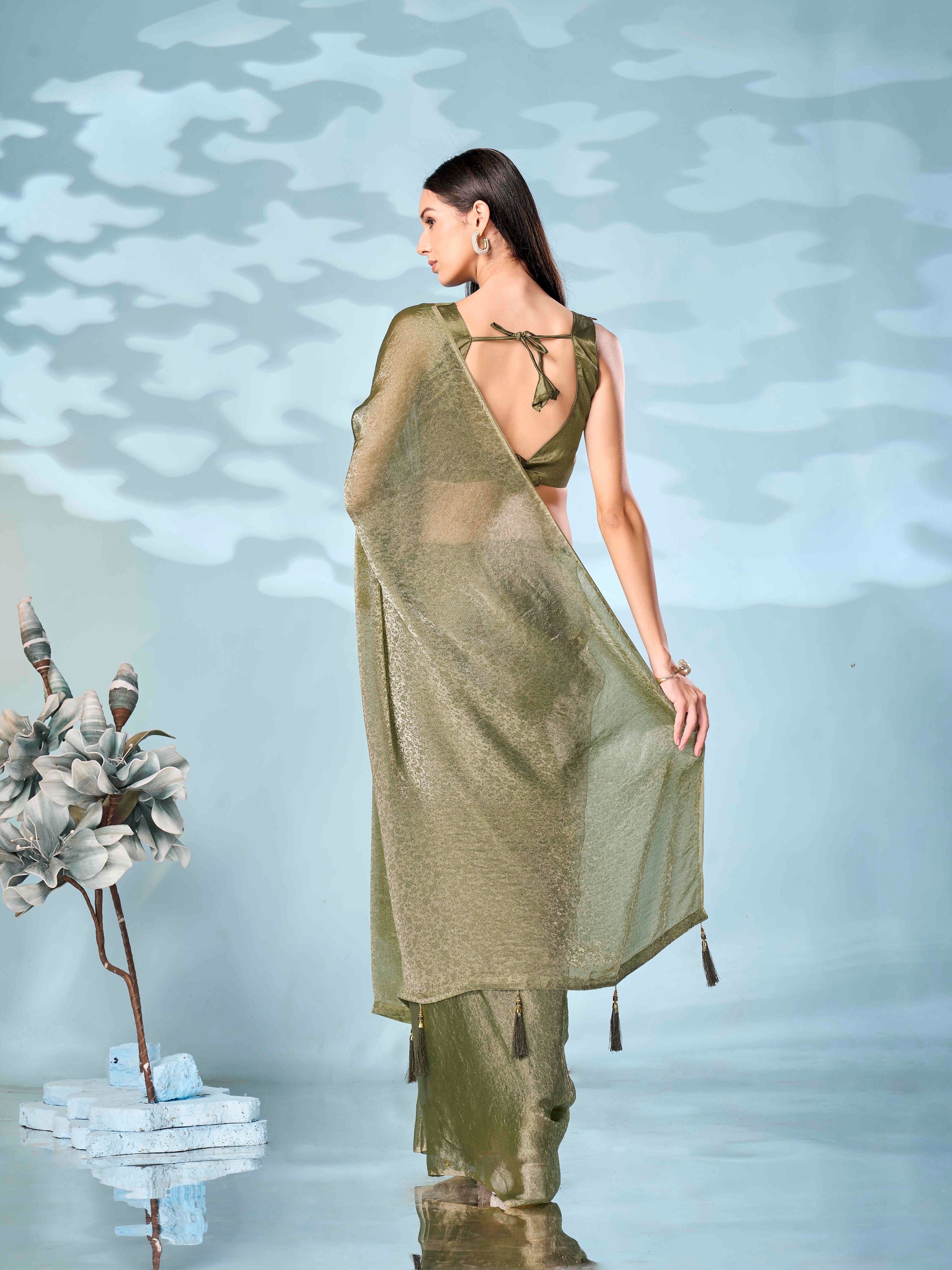 Two tone olive and gold colored woven saree with tassles on pallu