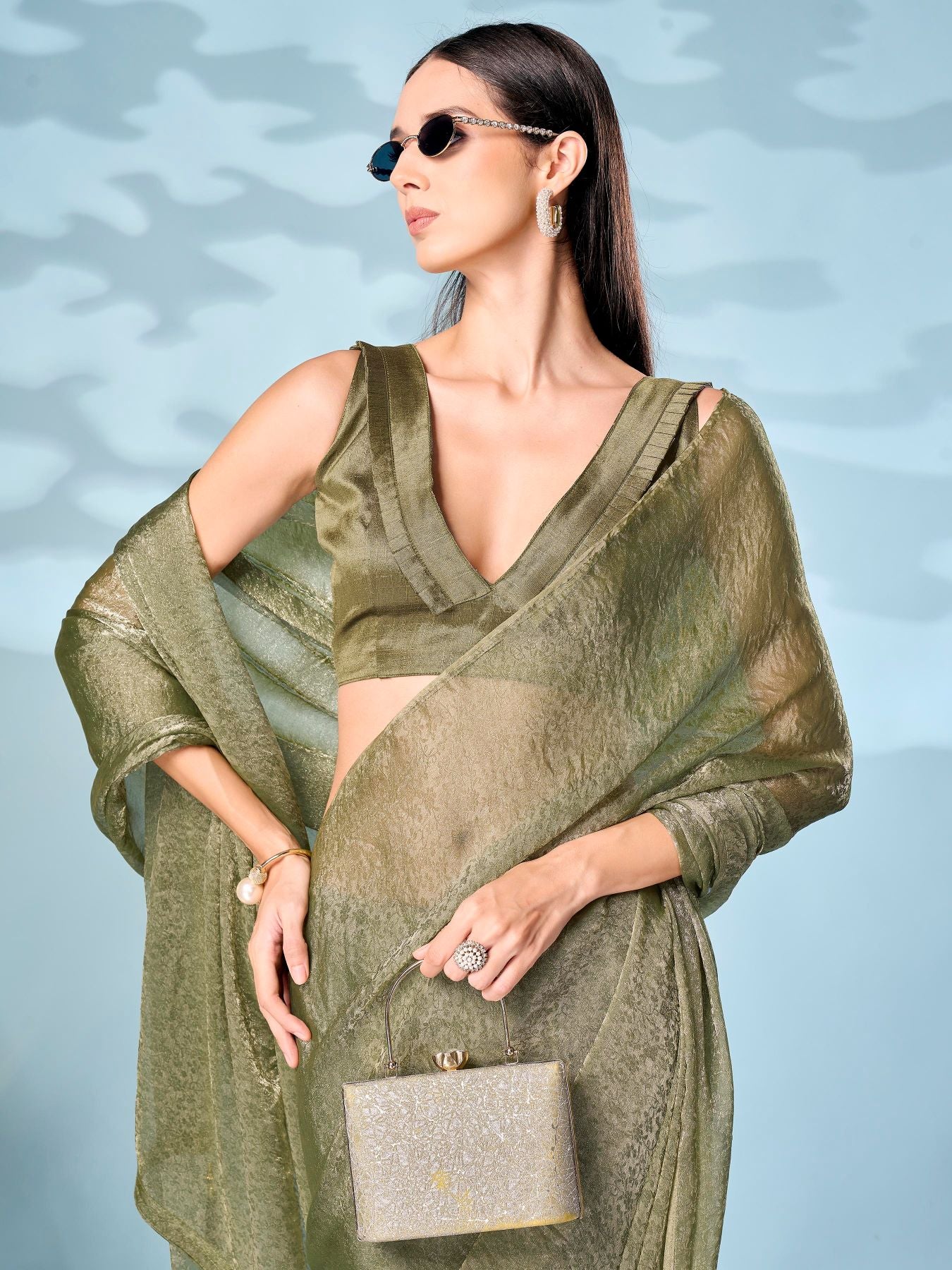 Two tone olive and gold colored woven saree with tassles on pallu