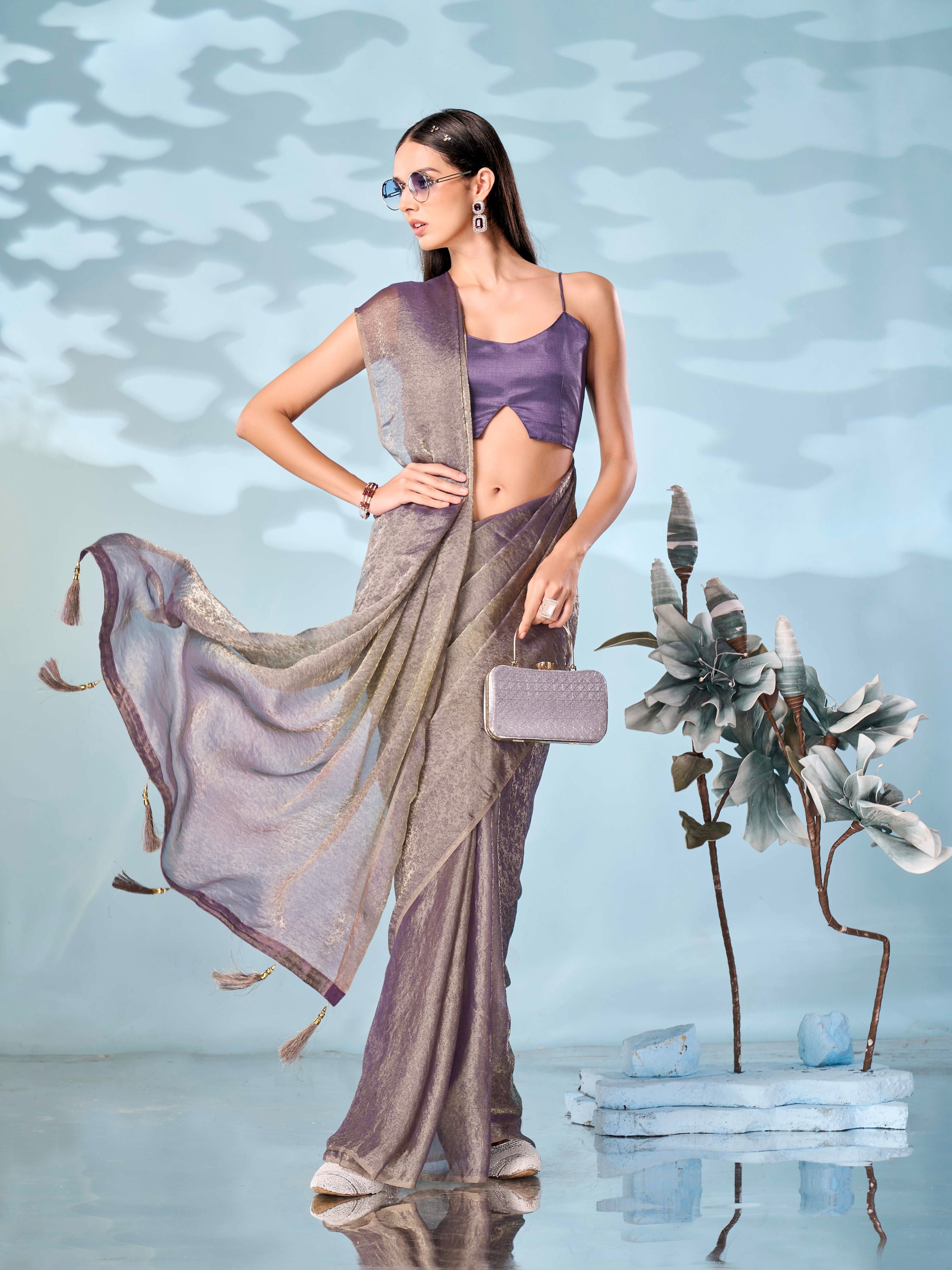 Two tone mauve and gold colored woven saree with tassles on pallu