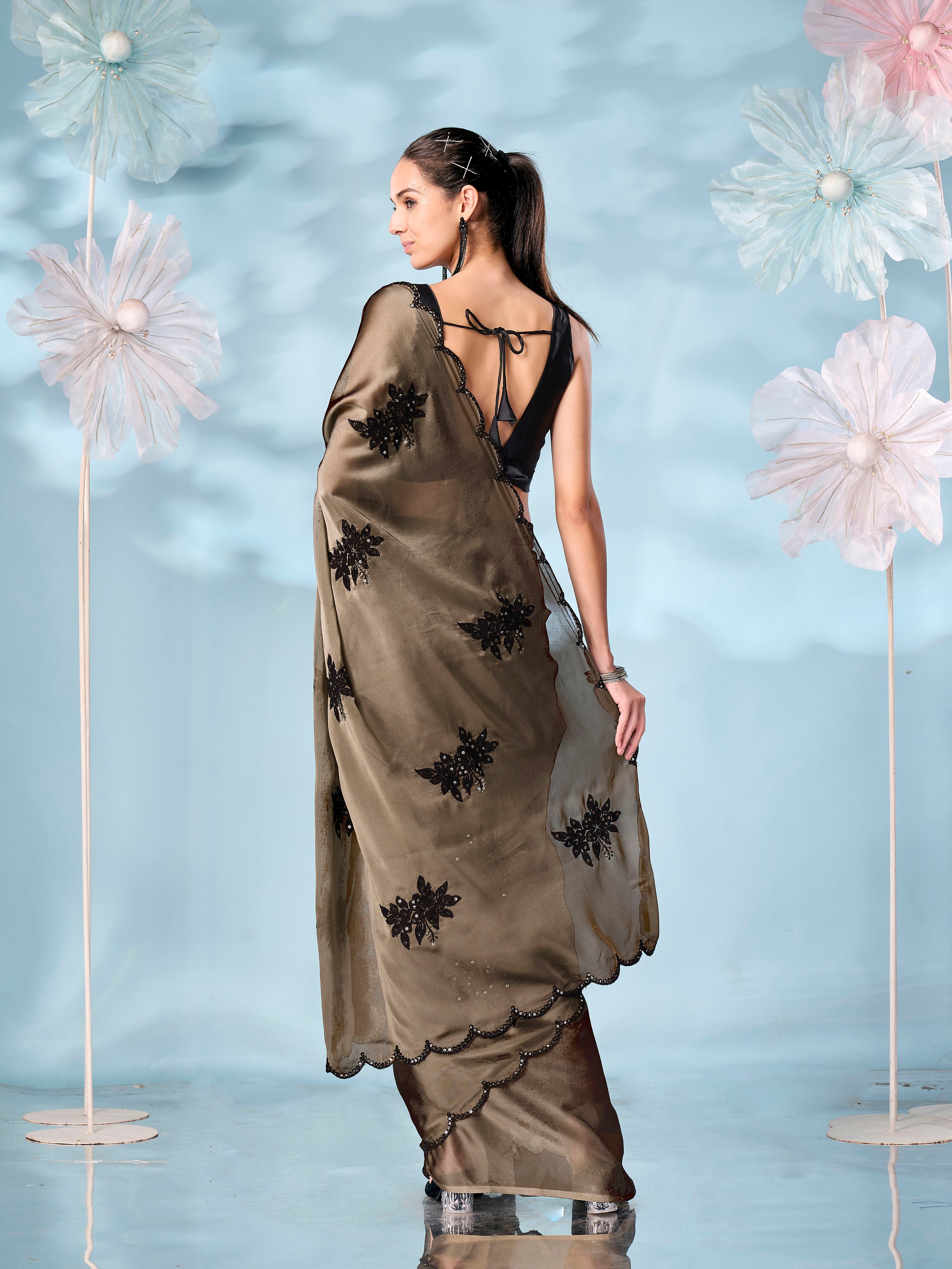 Olive colored sequinned emboidered saree with scalloped border