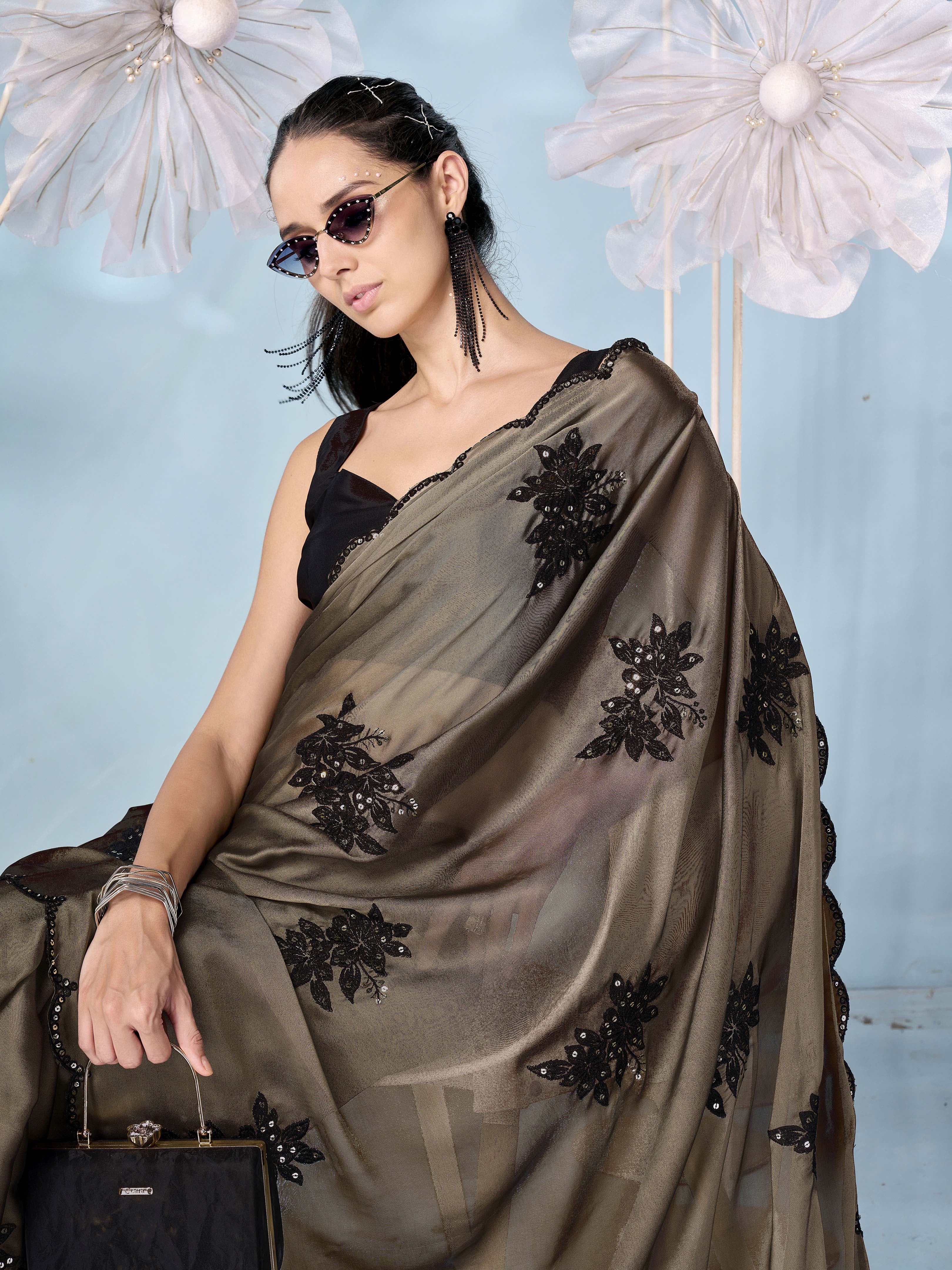 Olive colored sequinned emboidered saree with scalloped border