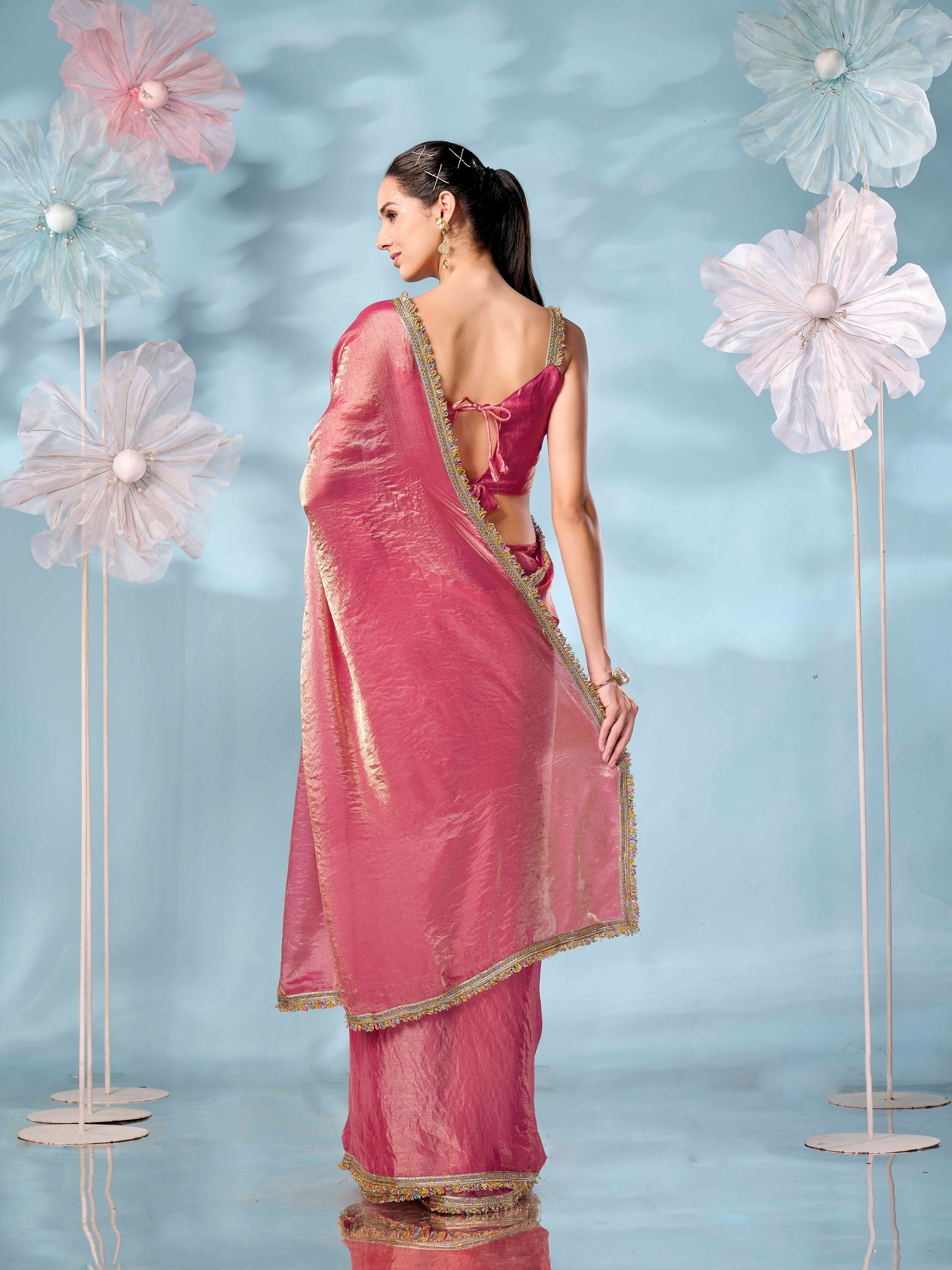 Pink and gold colored two tone jimmy choo saree with multicolor embellished lace border.