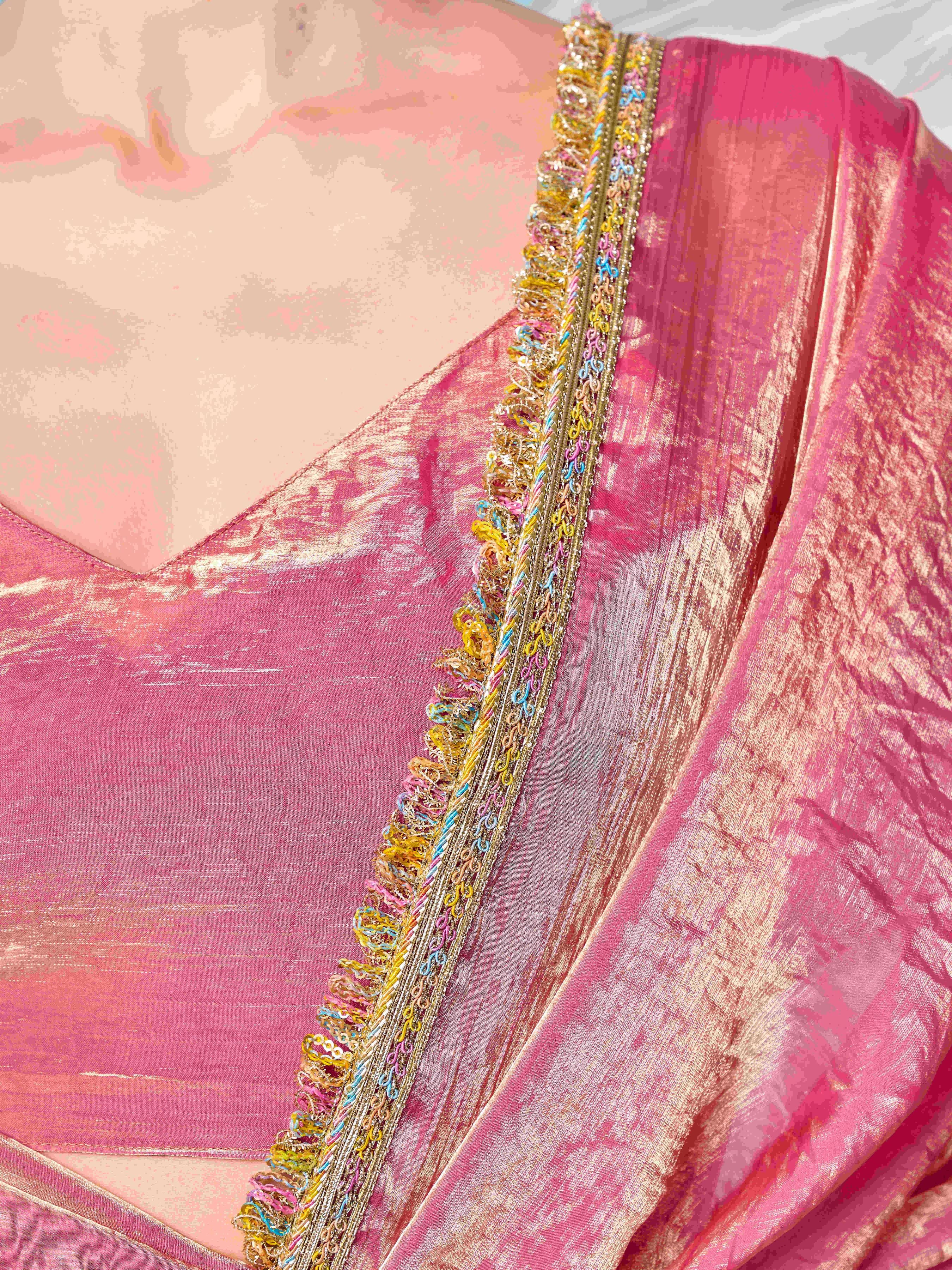 Pink and gold colored two tone jimmy choo saree with multicolor embellished lace border.