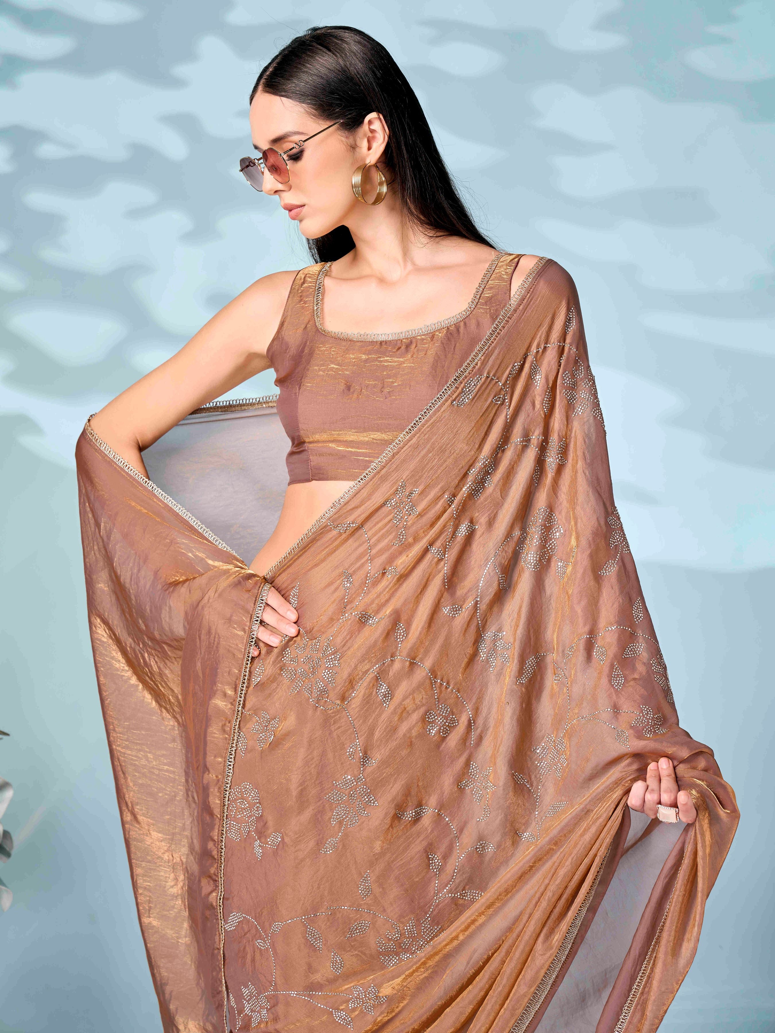 Dark Camel brown colored designer saree with swaroski work on shoulder portion and embellished borderf