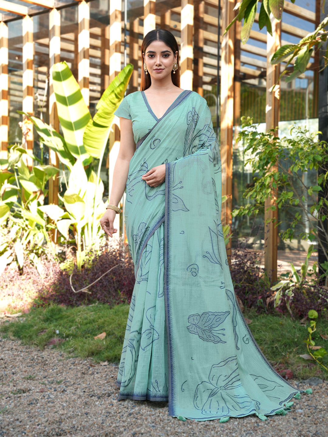 Blue colored muga cotton saree with tassles on pallu