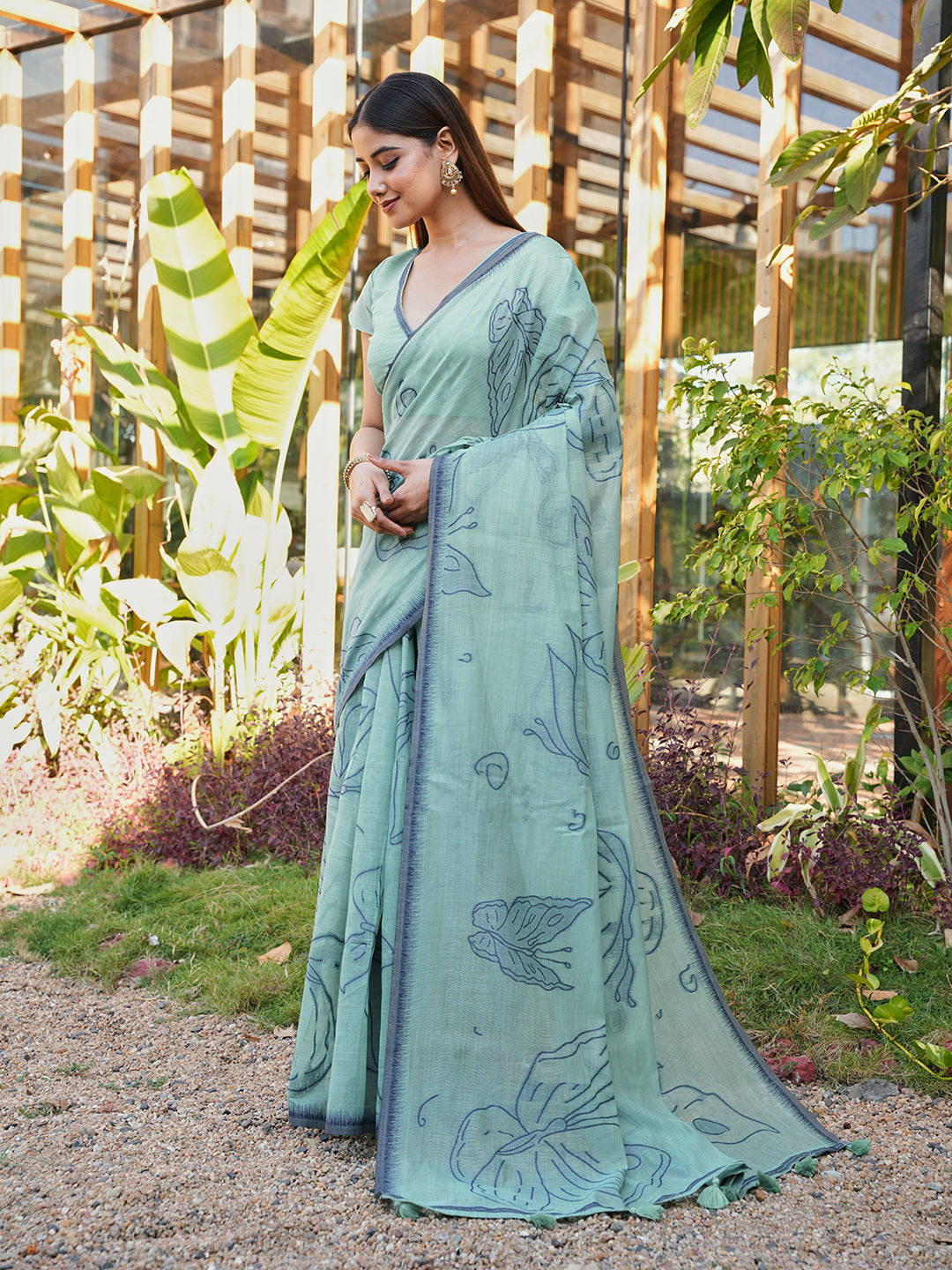 Blue colored muga cotton saree with tassles on pallu