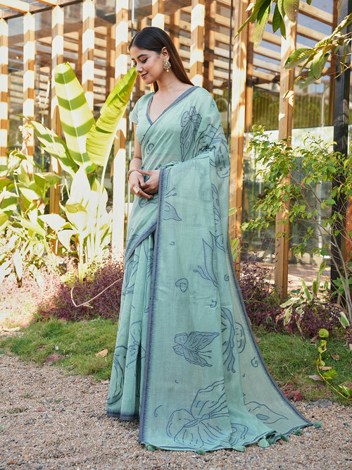 Blue colored muga cotton saree with tassles on pallu