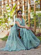Blue colored muga cotton saree with tassles on pallu