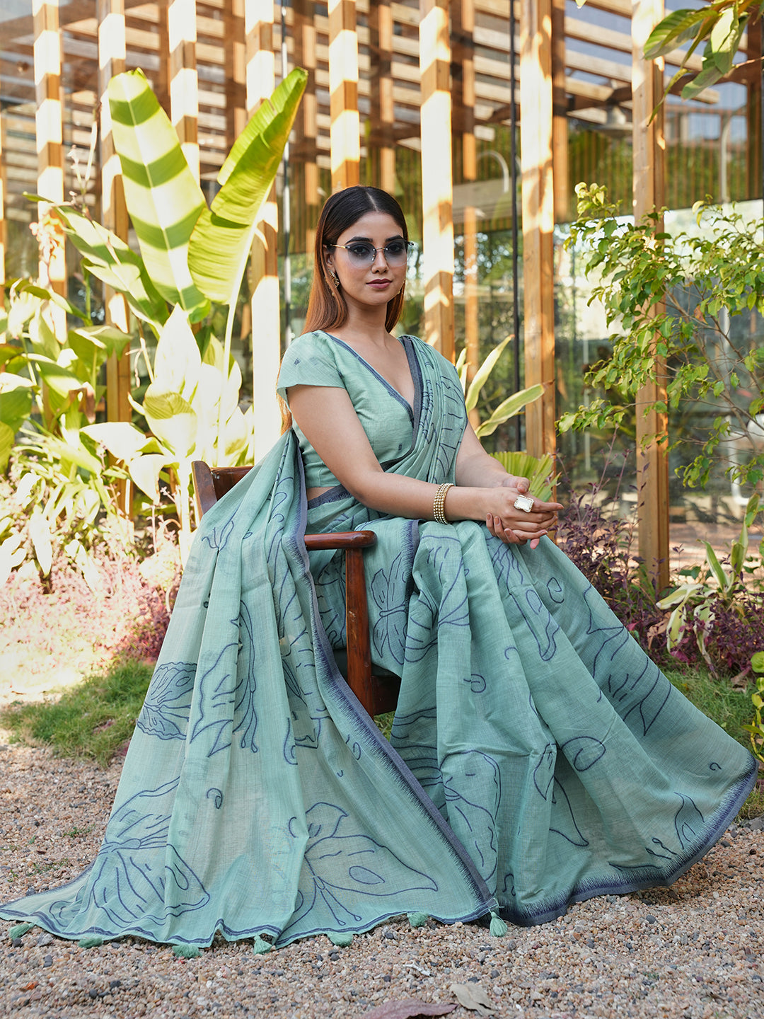 Blue colored muga cotton saree with tassles on pallu