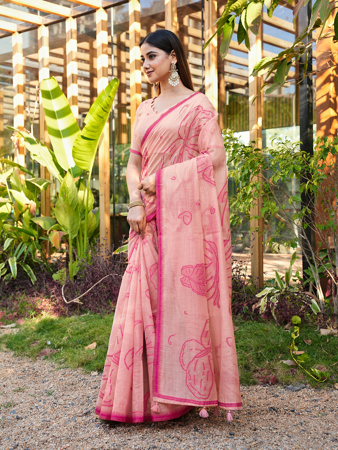 Pink colored muga cotton saree with tassles on pallu