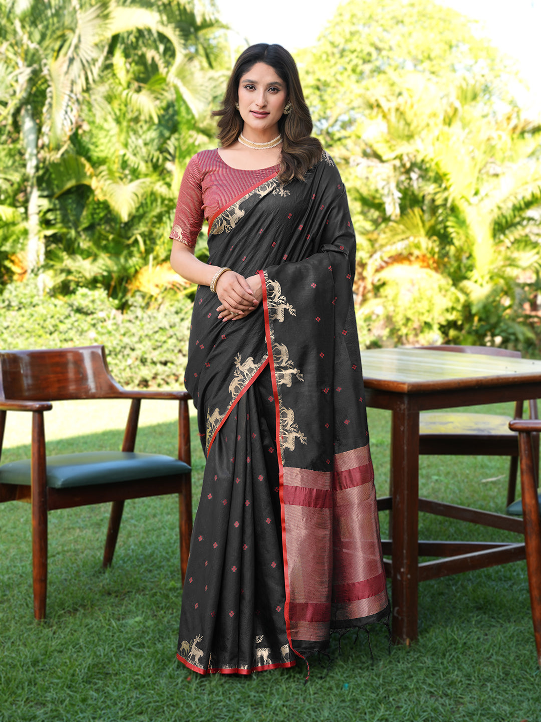 Black and red colored raw silk saree with tassles on pallu