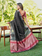 Black and red colored raw silk saree with tassles on pallu