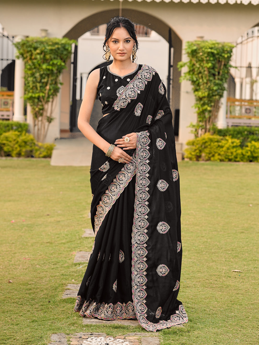 Black colored shimmer georgette base embroidered saree